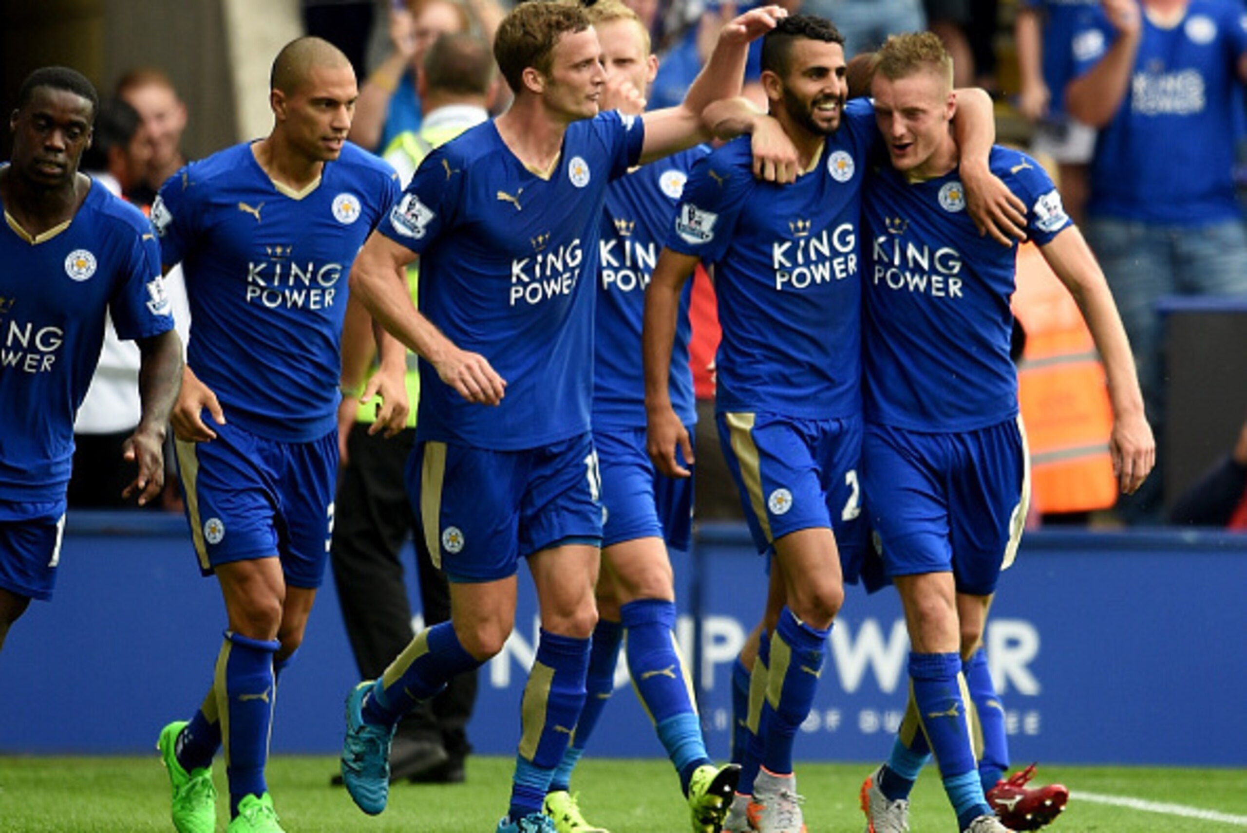 LEICESTER, ENGLAND - AUGUST 22: Riyad Mahrez of Leicester is congratulated after scoring during the Barclays Premier League match between Leicester City and Tottenham Hotspur at the King Power Stadium on August 22, 2015 in Leicester, United Kingdom.  (Pho