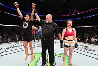 MONTREAL, QC - APRIL 25:   Randa Markos (L) of Canada celebrates her decision victory over Aisling Daly of Ireland in their women's strawweight bout during the UFC 186 event at the Bell Centre on April 25, 2015 in Montreal, Quebec, Canada. (Photo by Josh 