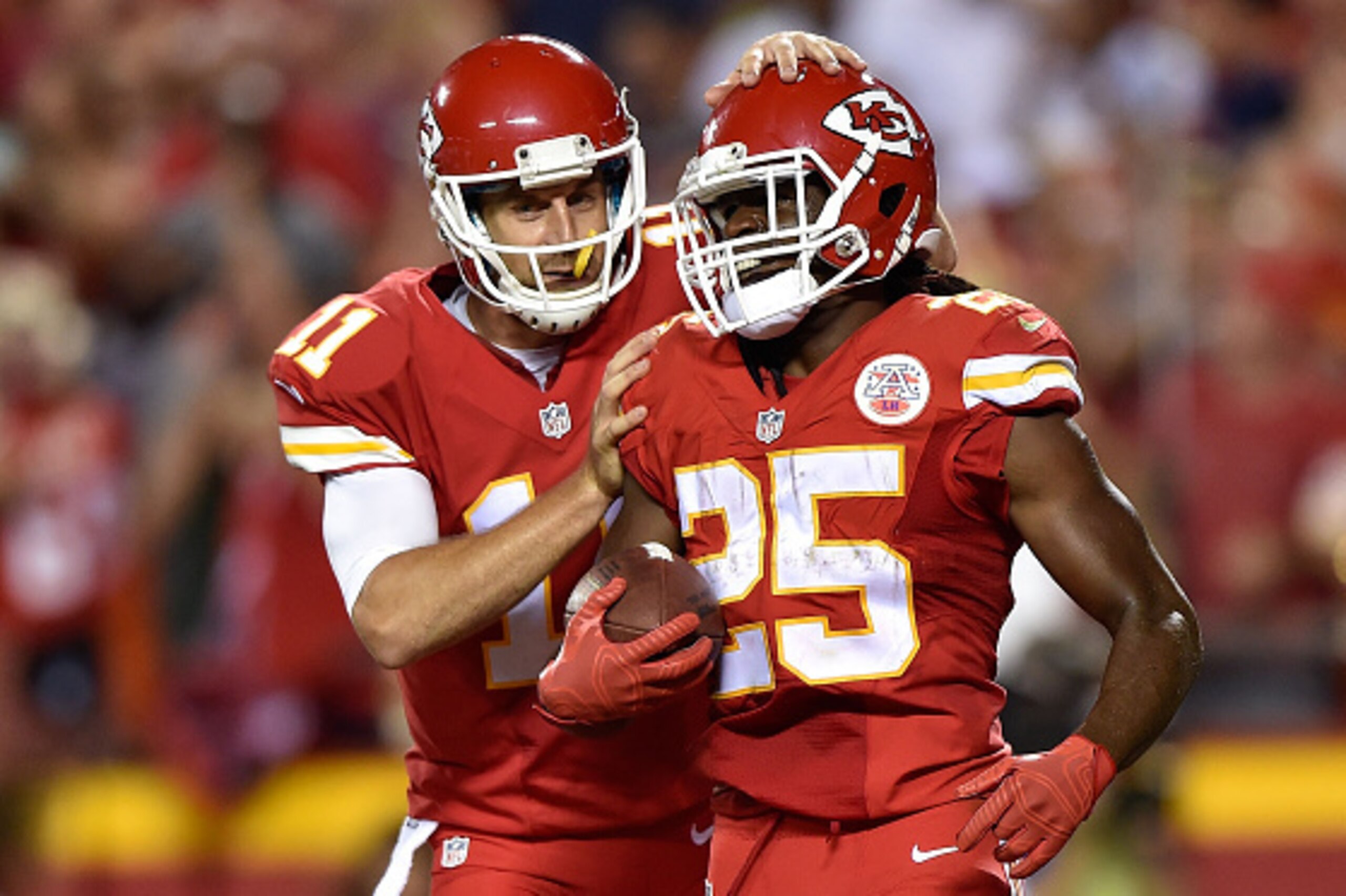 KANSAS CITY, MO - SEPTEMBER 17: Alex Smith #11 of the Kansas City Chiefs celebrates teammate Jamaal Charles #25 touchdown run during a game against the Denver Broncos at Arrowhead Stadium on September 17, 2015 in Kansas City, Missouri. (Photo by Peter Aik