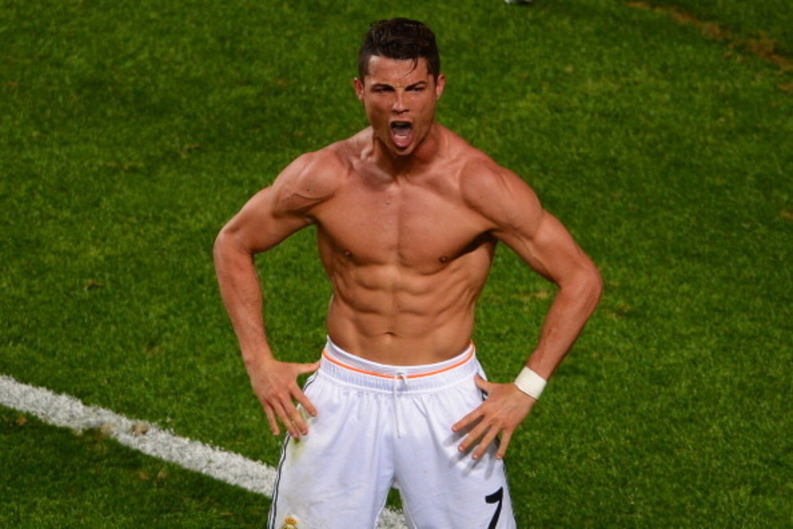 LISBON, PORTUGAL - MAY 24:  Cristiano Ronaldo of Real Madrid celebrates scoring their fourth goal from the penalty spot during the UEFA Champions League Final between Real Madrid and Atletico de Madrid at Estadio da Luz on May 24, 2014 in Lisbon, Portugal