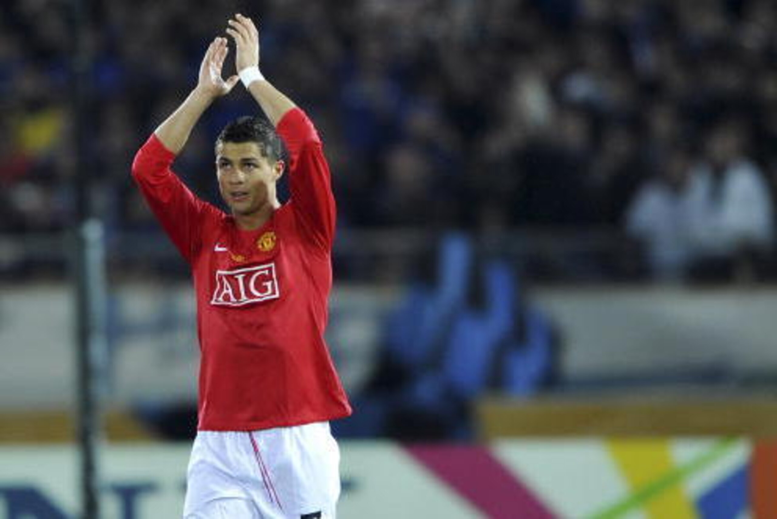 Cristiano Ronaldo of Manchester United acknowledges the crowd after scoring his team's second goal against Japan's club Gamba Osaka during the semi-final of the FIFA Club World Cup 2008 at International Stadium Yokohama in Kanagawa prefecture, suburban To