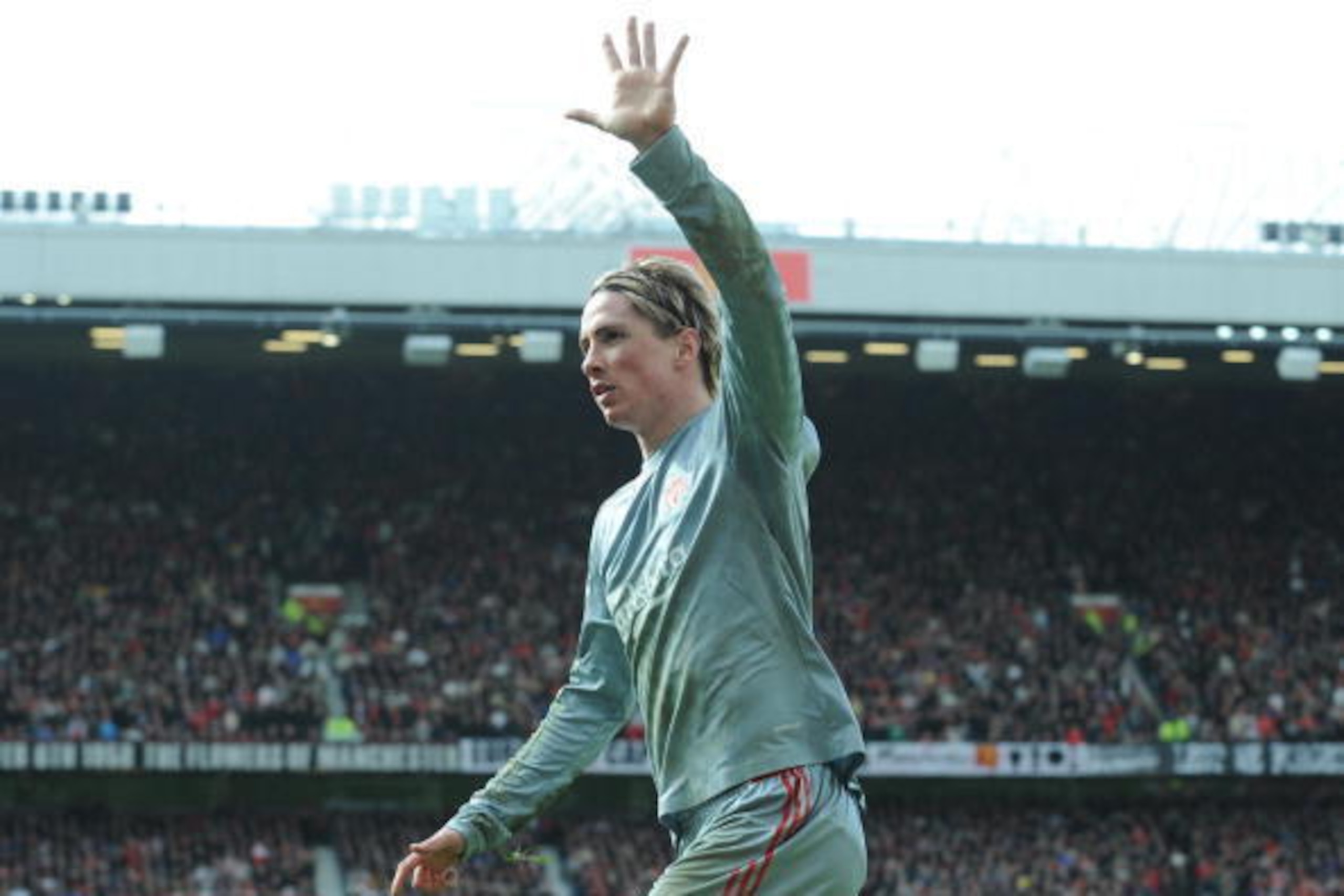 Liverpool's Spanish forward Fernando Torres celebrates scoring the equalising goal against Manchester United during their English Premier League football match at Old Trafford in Manchester, north west England on March 14, 2009. AFP PHOTO/ANDREW YATES - F