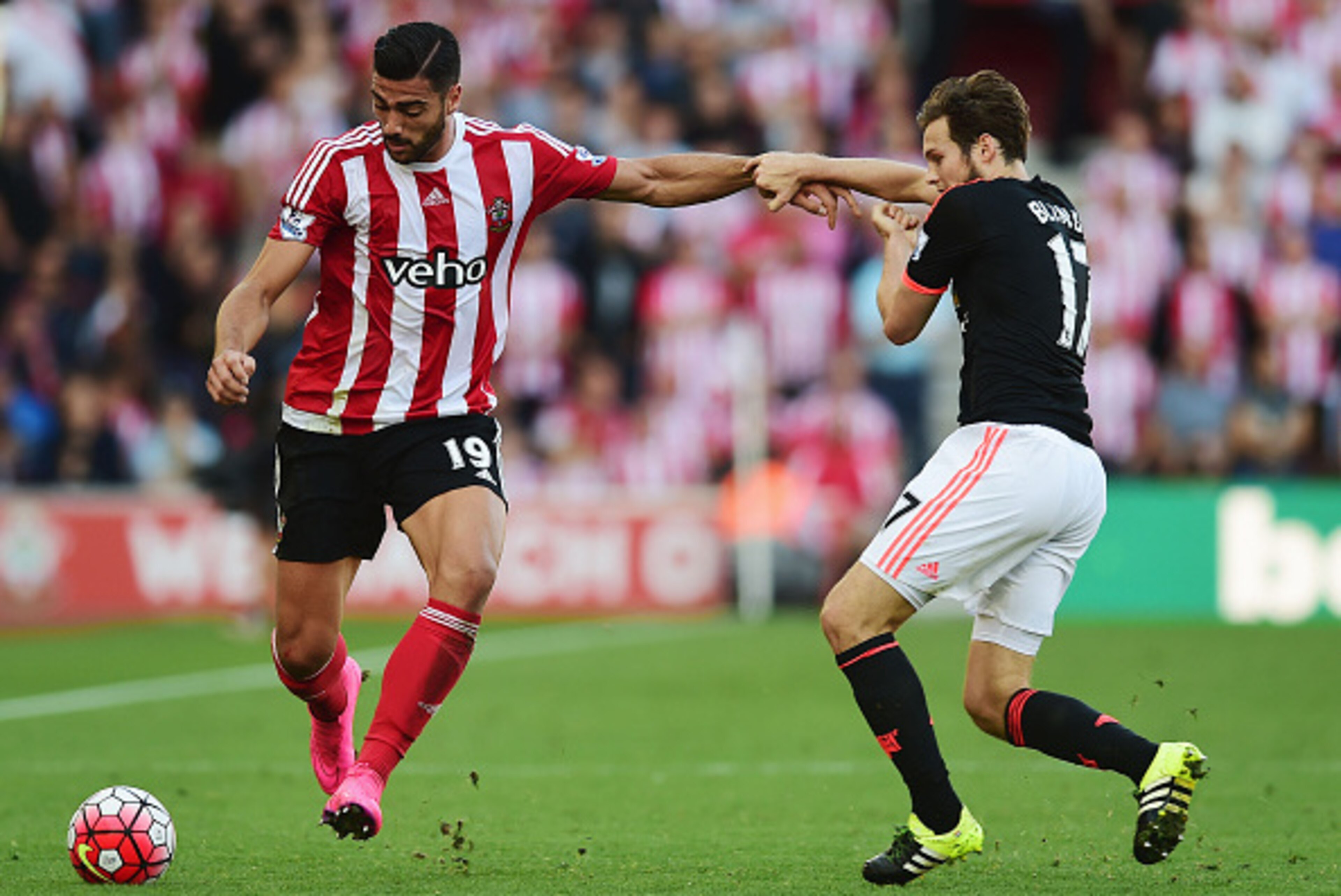 SOUTHAMPTON, ENGLAND - SEPTEMBER 20: Graziano Pelle of Southampton holds off Daley Blind of Manchester United during the Barclays Premier League match between Southampton and Manchester United at St Mary's Stadium on September 20, 2015 in Southampton, Un SOUTHAMPTON, ENGLAND - SEPTEMBER 20: Graziano Pelle of Southampton holds off Daley Blind of Manchester United during the Barclays Premier League match between Southampton and Manchester United at St Mary's Stadium on September 20, 2015 in Southampton, Un
