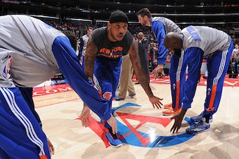 LOS ANGELES, CA - DECEMBER 31: Carmelo Anthony #7 of the New York Knicks gets introduced before a game against the Los Angeles Clippers at STAPLES Center on December 31, 2014 in Los Angeles, California. NOTE TO USER: User expressly acknowledges and agrees
