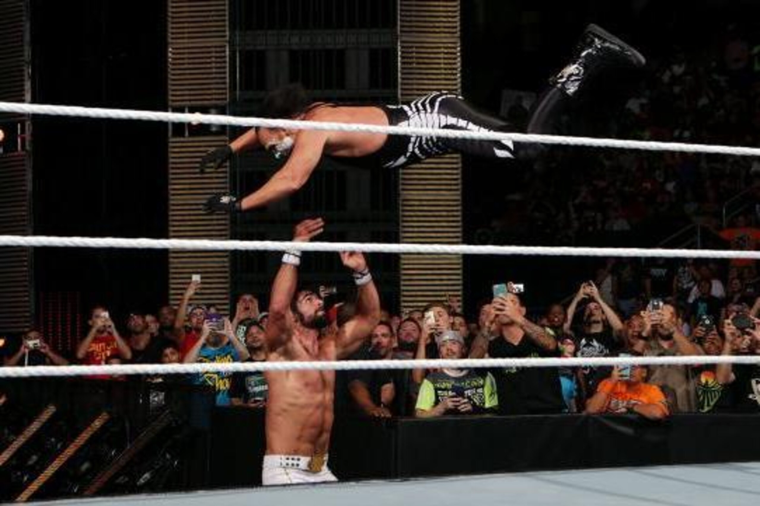 Sting leaps at Seth Rollins. Sting leaps at Seth Rollins.