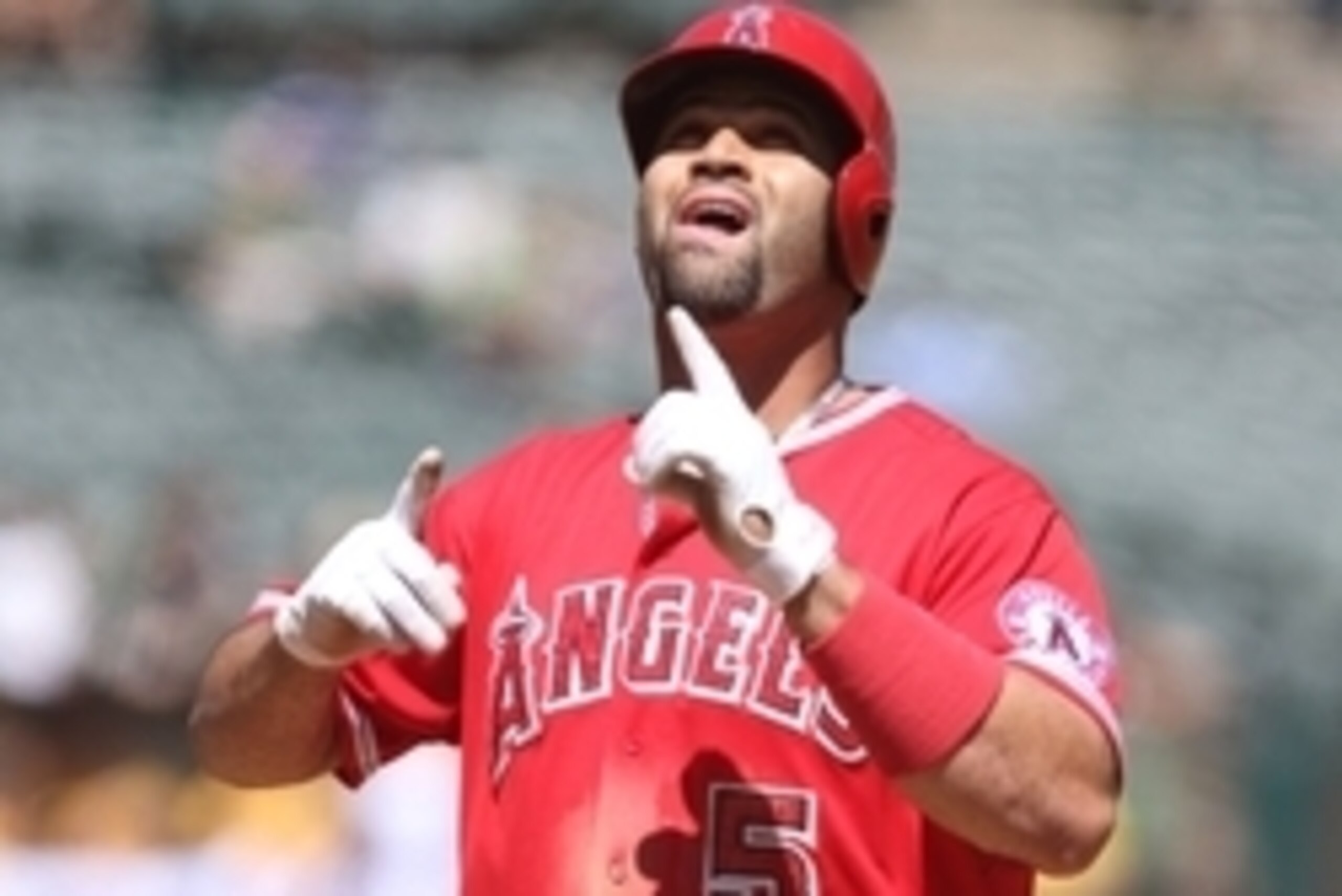 Sep 2, 2015; Oakland, CA, USA; Los Angeles Angels designated hitter Albert Pujols (5) celebrates after hitting a two run home run against the Oakland Athletics during the second inning at O.co Coliseum. Mandatory Credit: Kelley L Cox-USA TODAY Sports