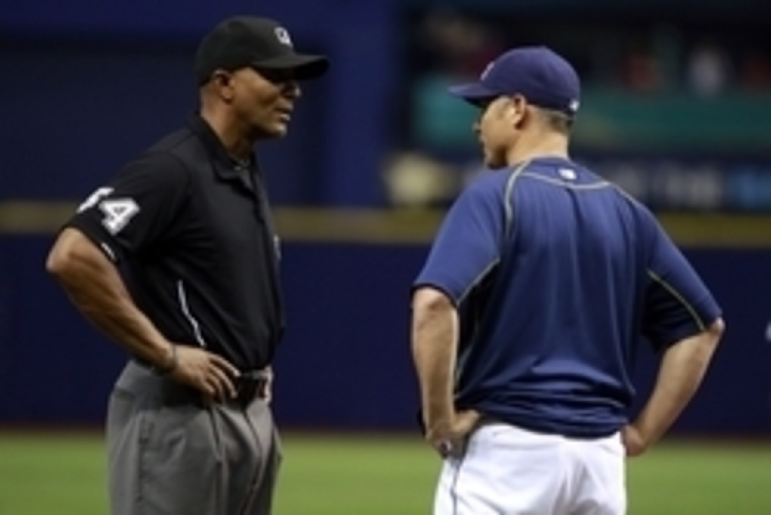 Sep 17, 2015; St. Petersburg, FL, USA; Tampa Bay Rays manager Kevin Cash (16) talks with third base umpire CB Bucknor (54) during the fourth inning against the Baltimore Orioles at Tropicana Field. Mandatory Credit: Kim Klement-USA TODAY Sports