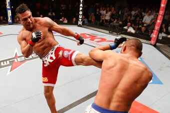 GOIANIA, BRAZIL - NOVEMBER 09:  (L-R) Vitor Belfort kicks Dan Henderson in their light heavyweight bout during the UFC event at Arena Goiania on November 9, 2013 in Goiania, Brazil. (Photo by Josh Hedges/Zuffa LLC/Zuffa LLC via Getty Images)
