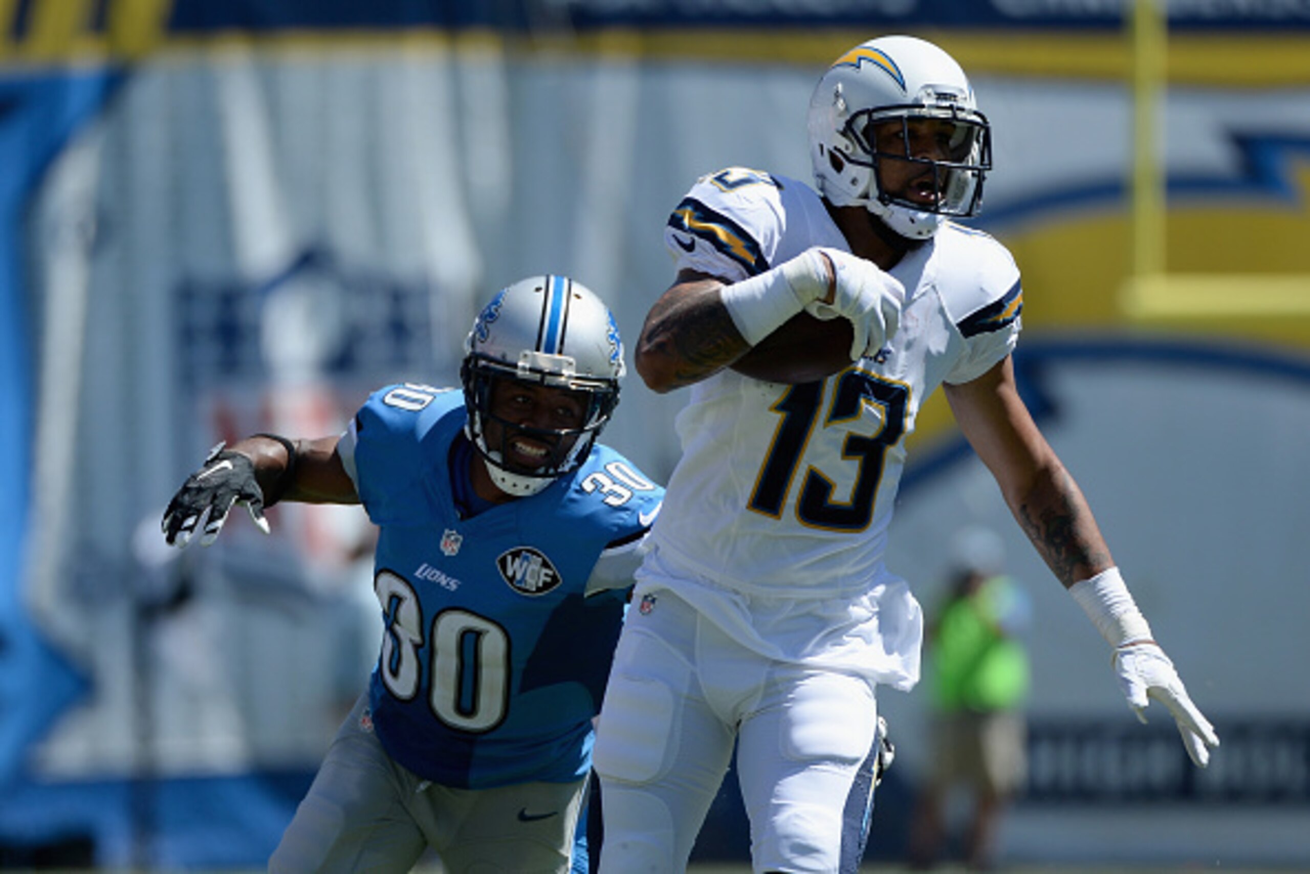 SAN DIEGO, CA - SEPTEMBER 13:  Wide receiver Keenan Allen #13 of the San Diego Chargers is pursued by defensive back Josh Wilson #30 of the Detroit Lions at Qualcomm Stadium on September 13, 2015 in San Diego, California.  (Photo by Donald Miralle/Getty I