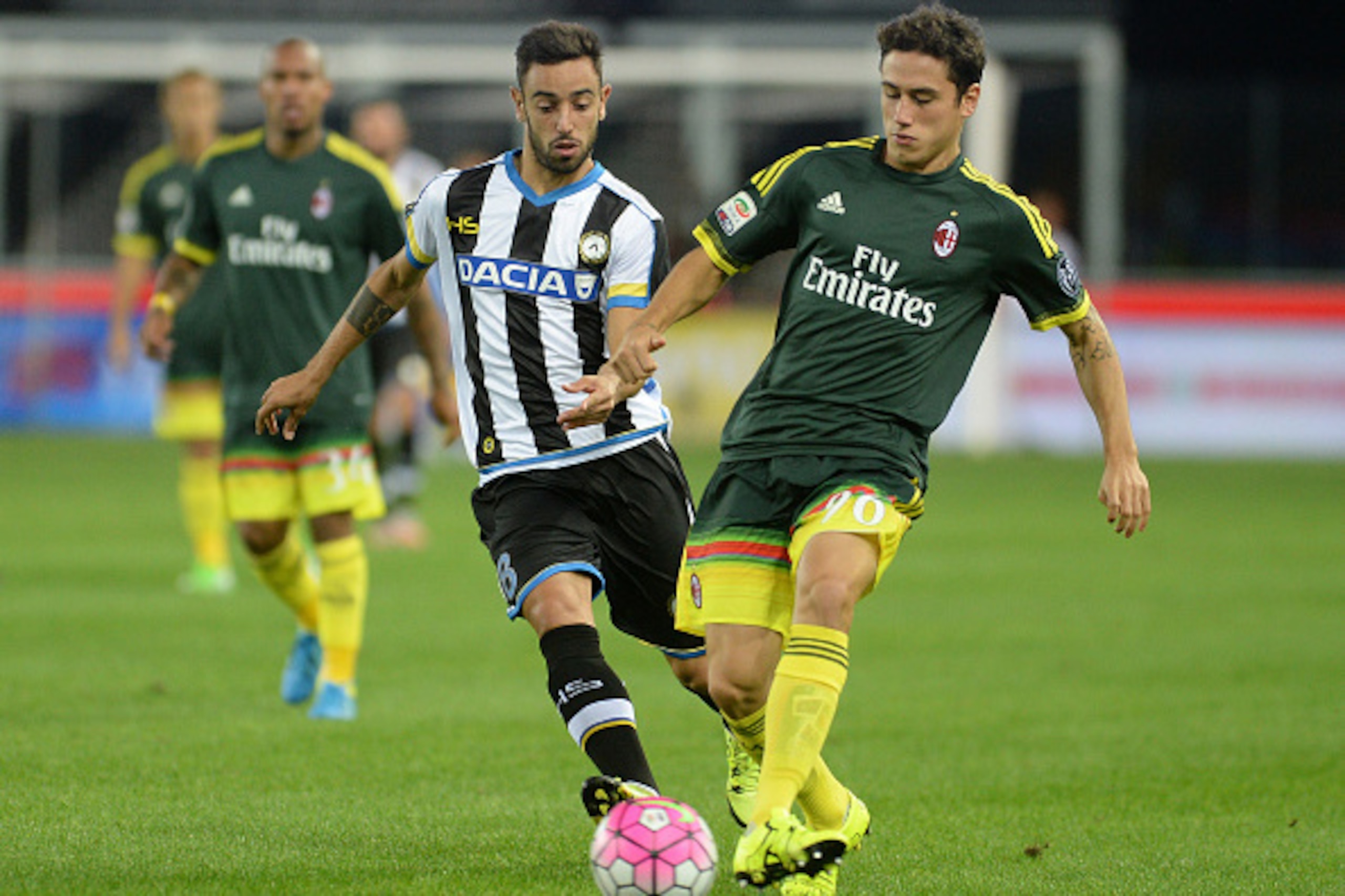 UDINE, ITALY - SEPTEMBER 22:  Bruno Fernandes Borges of Udinese Calcio competes with Davide Calabria of AC Milan during the Serie A match between Udinese Calcio and AC Milan at Stadio Friuli on September 22, 2015 in Udine, Italy.  (Photo by Dino Panato/Ge