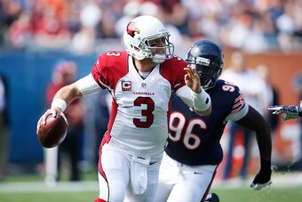 CHICAGO, IL - SEPTEMBER 20: Carson Palmer #3 of the Arizona Cardinals looks to pass while under pressure from Jarvis Jenkins #96 of the Chicago Bears in the first quarter at Soldier Field on September 20, 2015 in Chicago, Illinois. (Photo by Joe Robbins/G