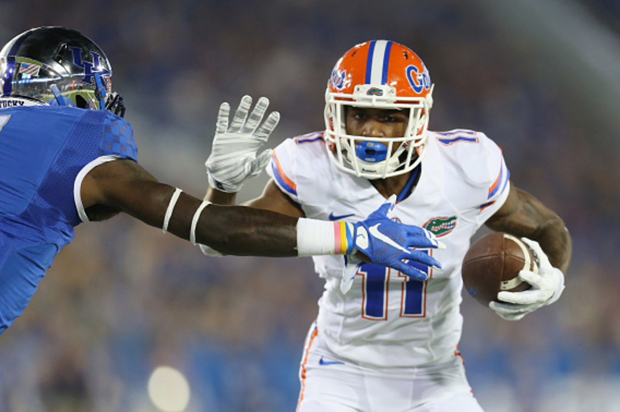 LEXINGTON, KY - SEPTEMBER 19:  Demarcus Robinson #11 of the Florida Gators runs with the ball while defended by J.D. Harmon #11 of the Kentucky Wildcats at Commonwealth Stadium on September 19, 2015 in Lexington, Kentucky.  (Photo by Andy Lyons/Getty Imag
