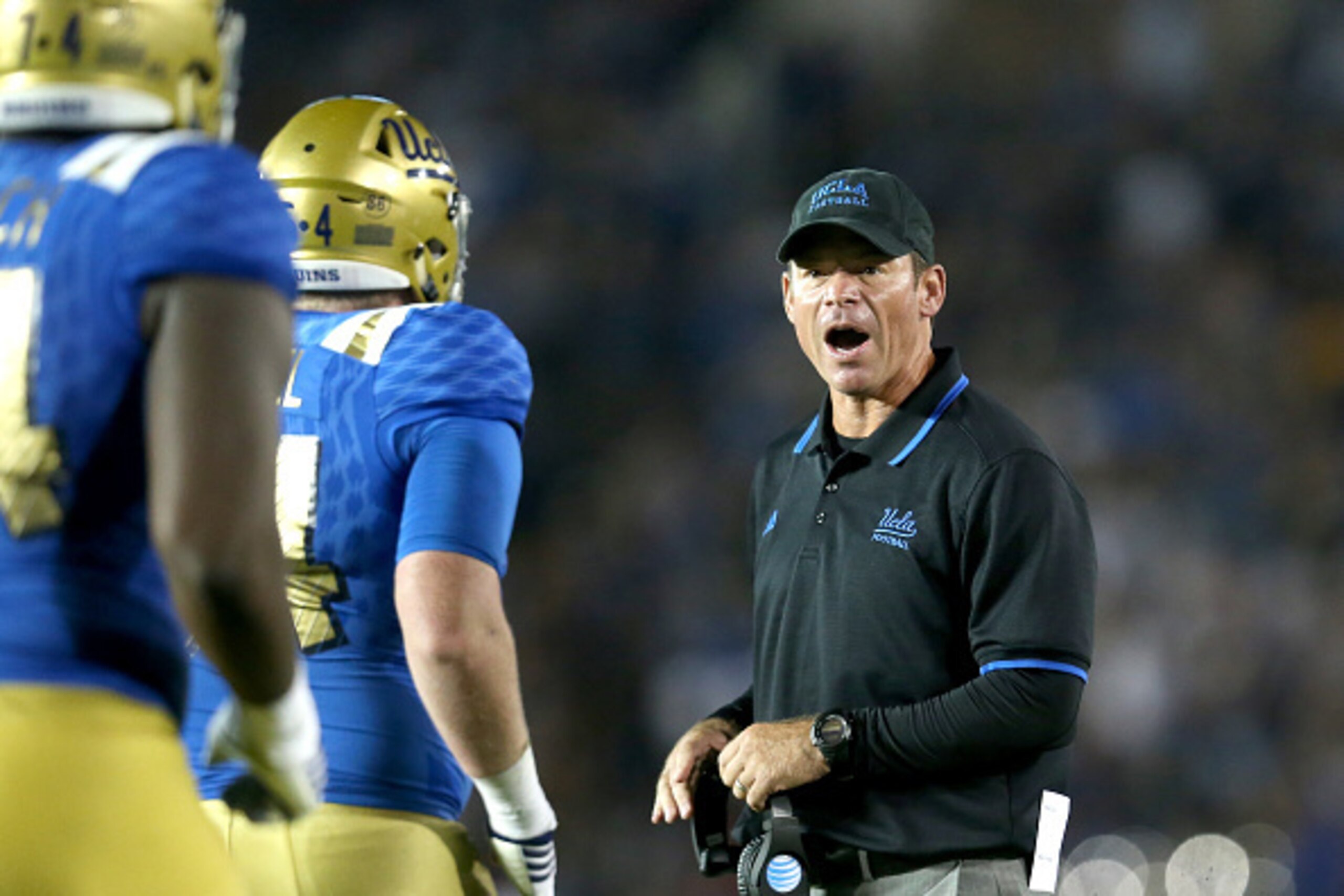 PASADENA, CA - SEPTEMBER 19:  Head coach Jim Mora of the UCLA Bruins greets players after a third quarter UCLA touchdown against the BYU Cougars at the Rose Bowl on September 19, 2015 in Pasadena, California.  UCLA won 24-23.  (Photo by Stephen Dunn/Getty
