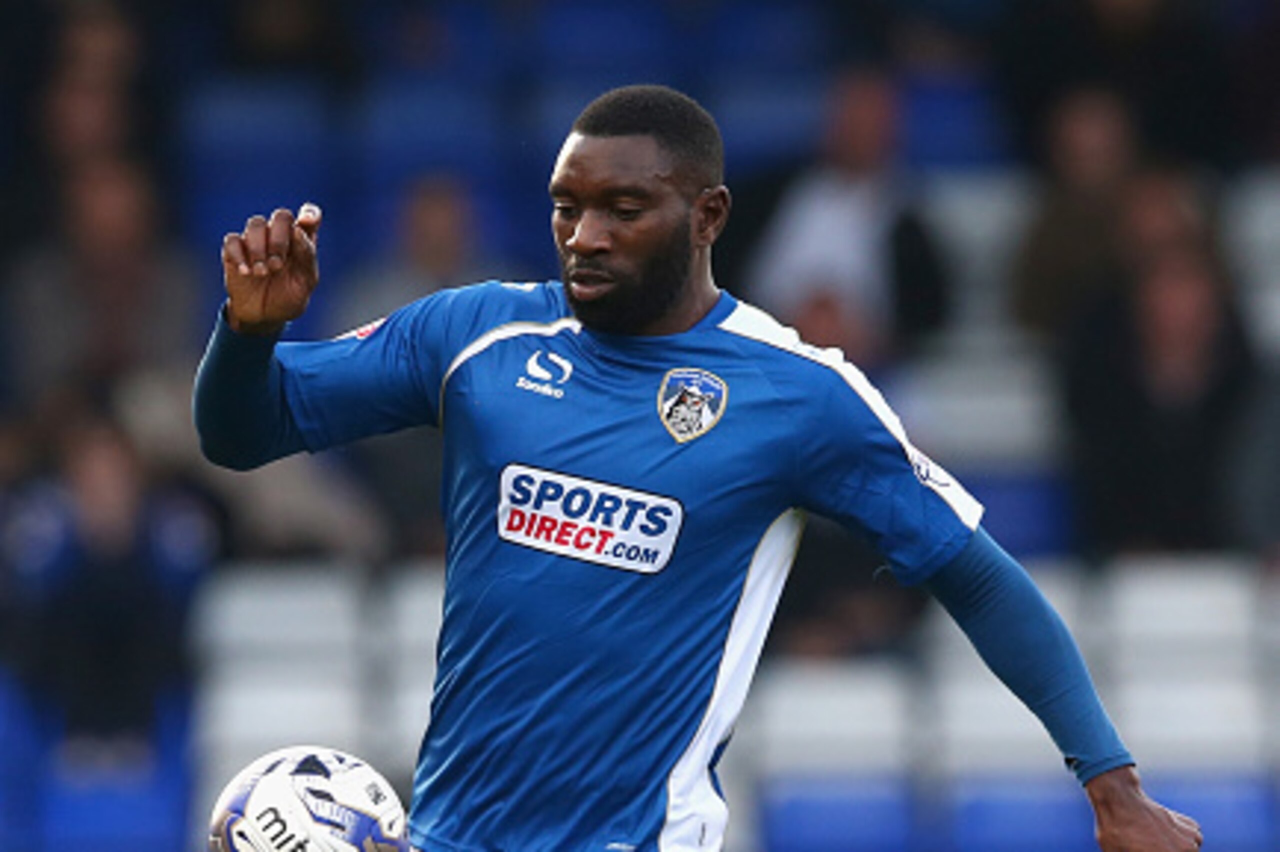 OLDHAM, ENGLAND - OCTOBER 11: Jabo Ibehre of Oldham Athletic in action during the Sky Bet League One match between Oldham Athletic and Walsall at Boundary Park on October 11, 2014 in Oldham, England.  (Photo by Clive Brunskill/Getty Images)
