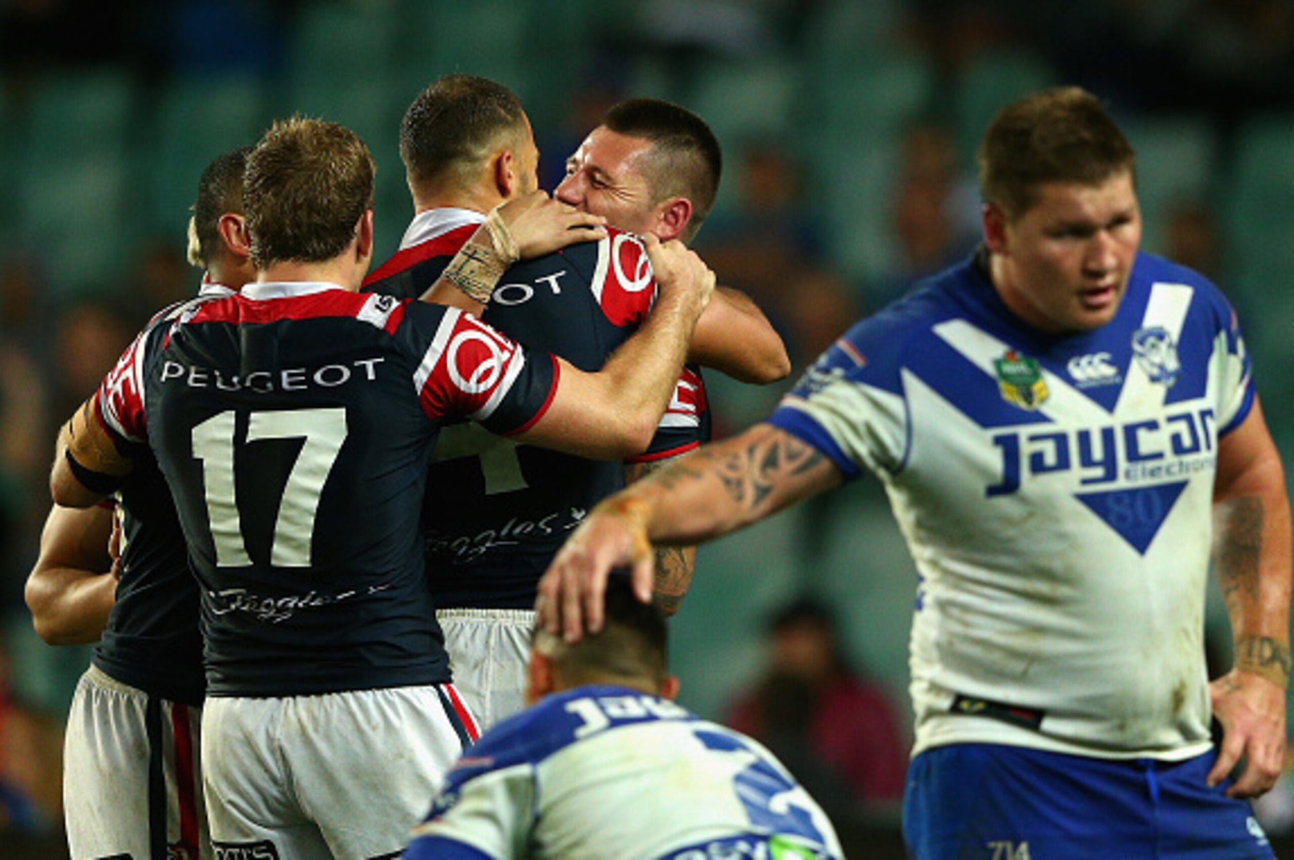 SYDNEY, AUSTRALIA - SEPTEMBER 18:  Shaun Kenny-Dowall of the Roosters celebrates scoring a try with team mates during the First NRL Semi Final match between the Sydney Roosters and the Canterbury Bulldogs at Allianz Stadium on September 18, 2015 in Sydney