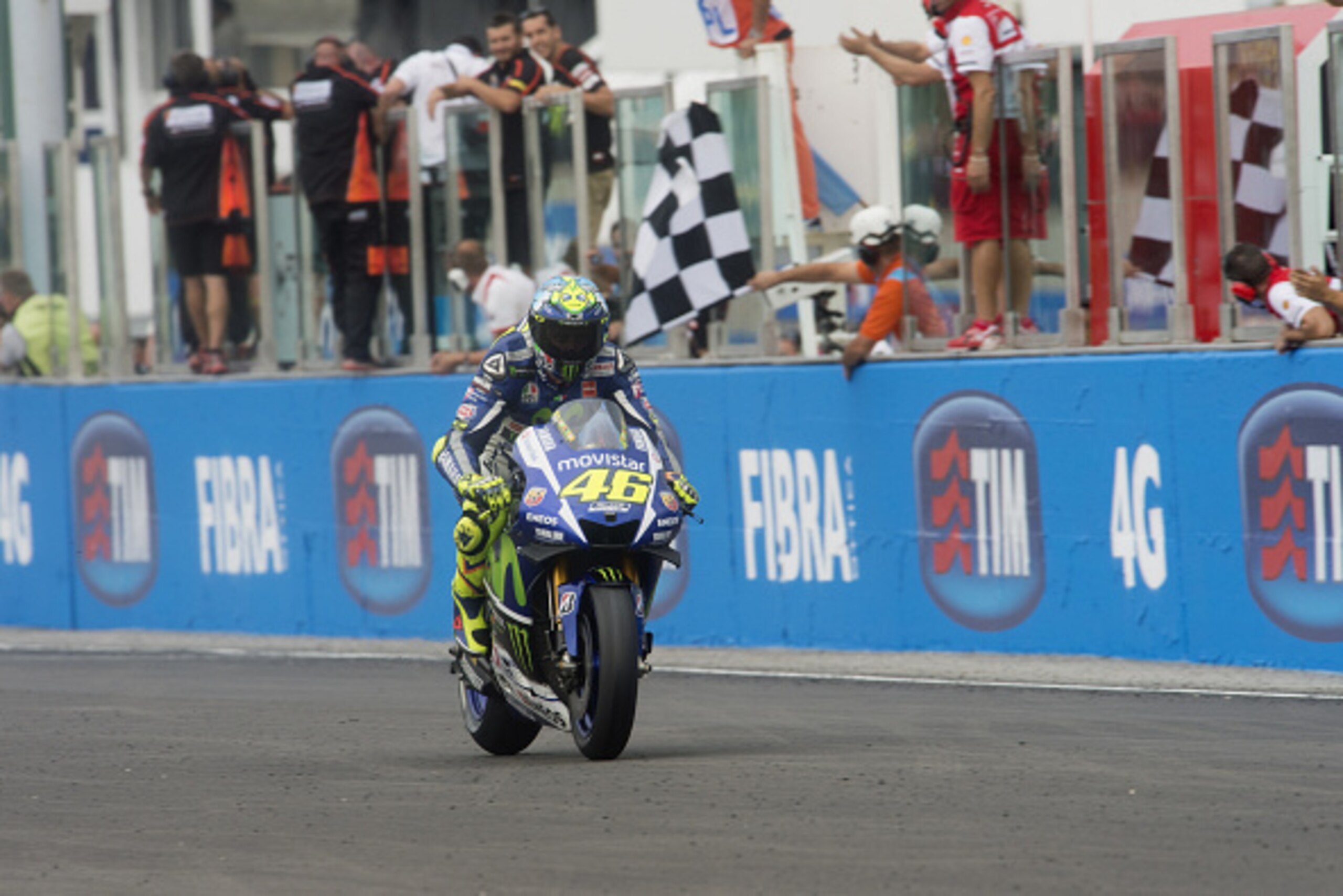 MISANO ADRIATICO, ITALY - SEPTEMBER 13:  Valentino Rossi of Italy and Movistar Yamaha MotoGP cuts the finish lane at the end of the MotoGP World Championship race during the San Marino GP at Misano World Circuit on September 13, 2015 in Misano Adriatico, 