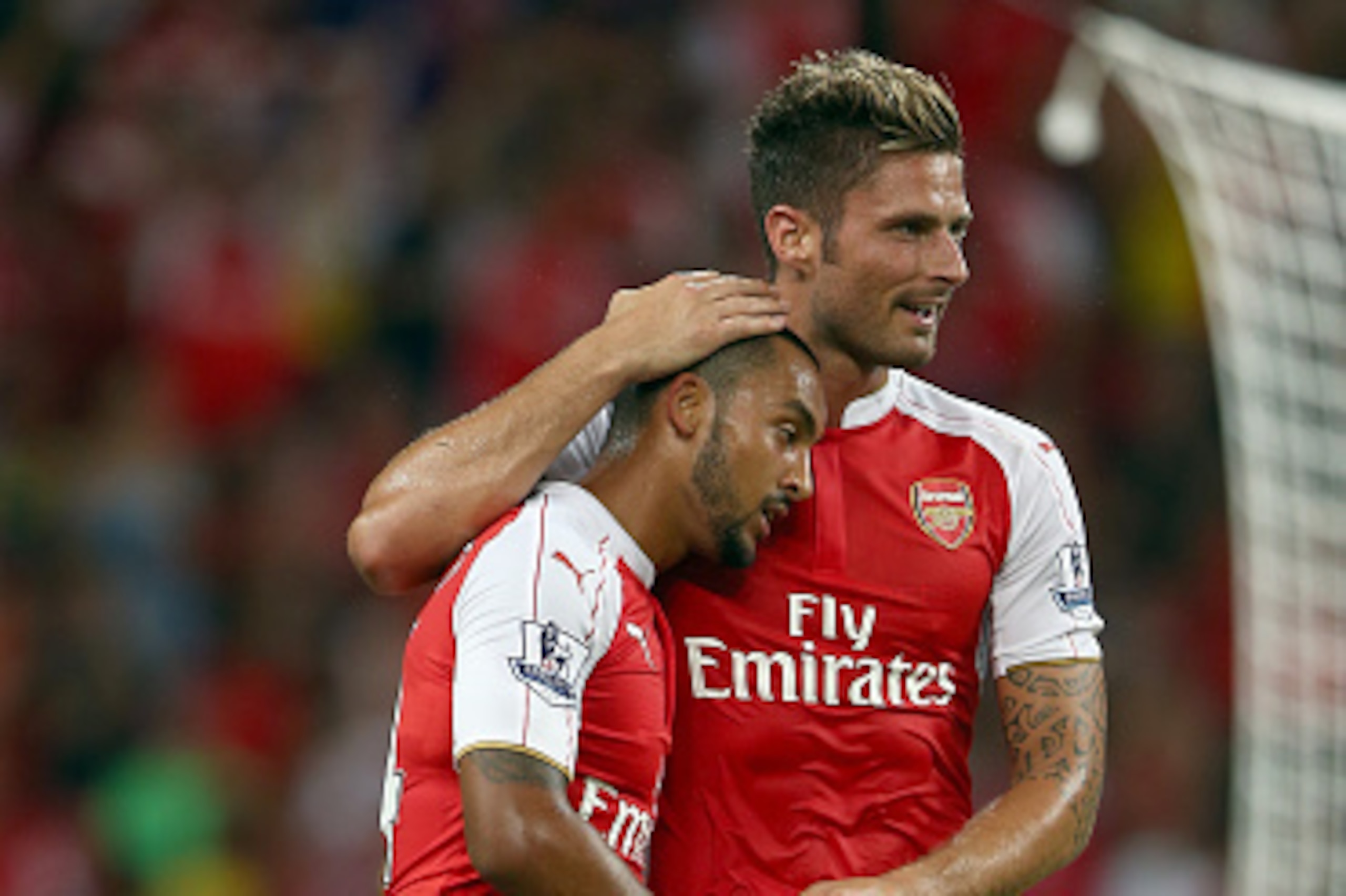 SINGAPORE - JULY 18:  Theo Walcott of Arsenal celebrates with Olivier Giroud after scoring the 1st goal against Everton during the Barclays Asia Trophy final match between Arsenal and Everton at the National Stadium on July 18, 2015 in Singapore.  (Photo 
