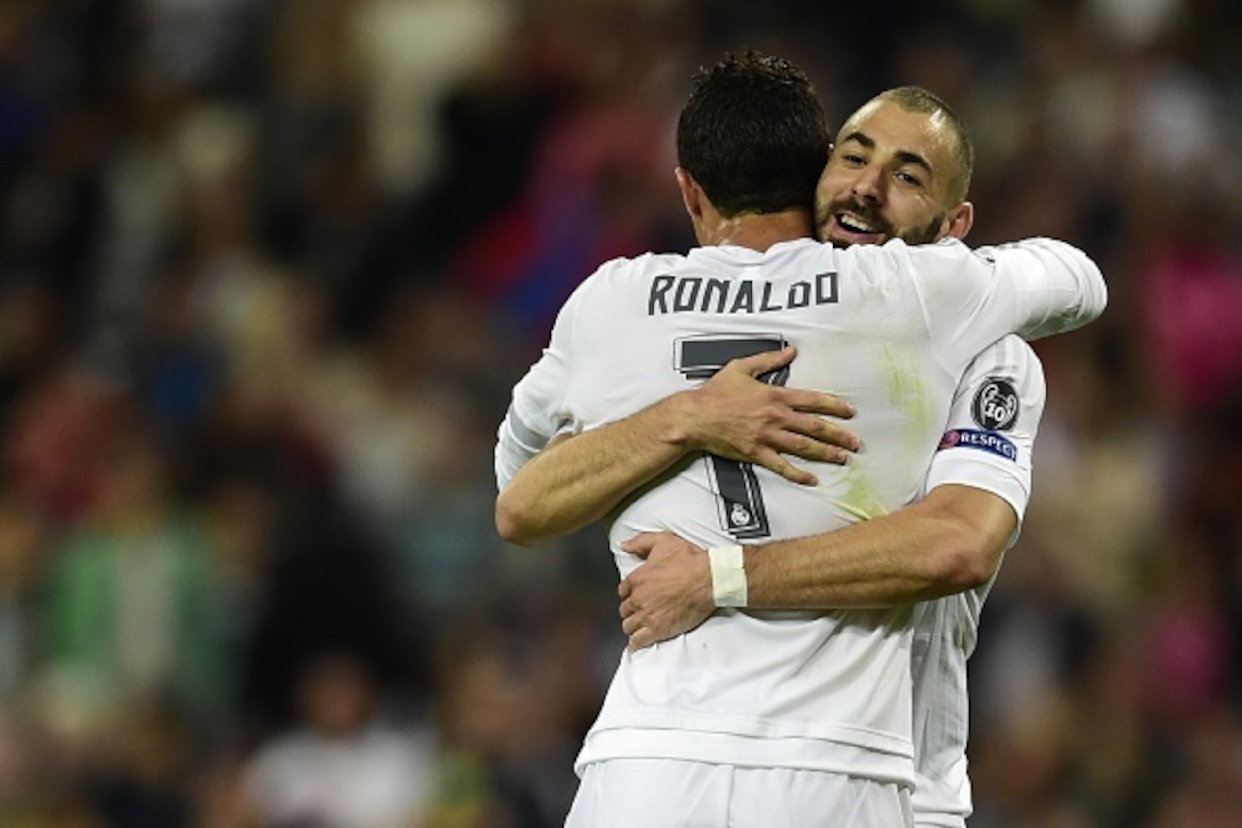 Real Madrid's French forward Karim Benzema (R) celebrates a goal with Real Madrid's Portuguese forward Cristiano Ronaldo during the UEFA Champions League group A football match Real Madrid CF vs FC Shakhtar Donetsk at the Santiago Bernabeu stadium in Madr