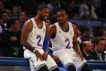 NEW YORK, NY - FEBRUARY 15: John Wall (L) #2 of the Washington Wizards  and the Eastern Conference talks with Kyrie Irving (R) #2 of the Cleveland Cavaliers and the Eastern Conference during the 2015 NBA All-Star Game at Madison Square Garden on February 