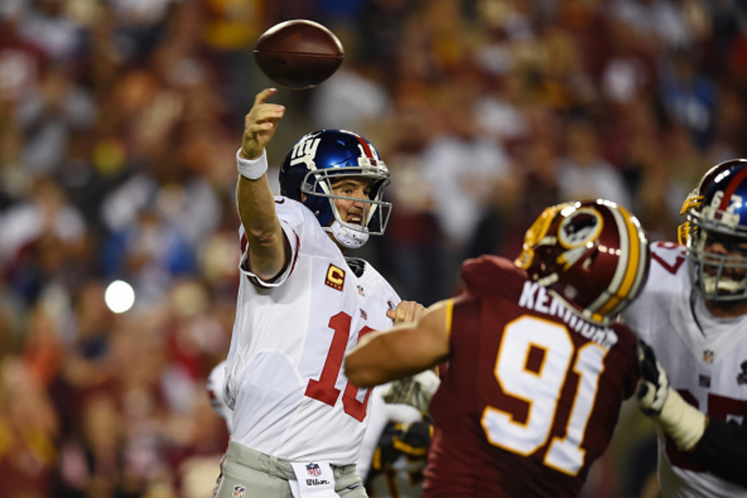 LANDOVER, MD - SEPTEMBER 25: Quarterback Eli Manning #10 of the New York Giants throws against the Washington Redskins during their game at FedExField on September 25, 2014 in Landover, Maryland. (Photo by Patrick Smith/Getty Images)