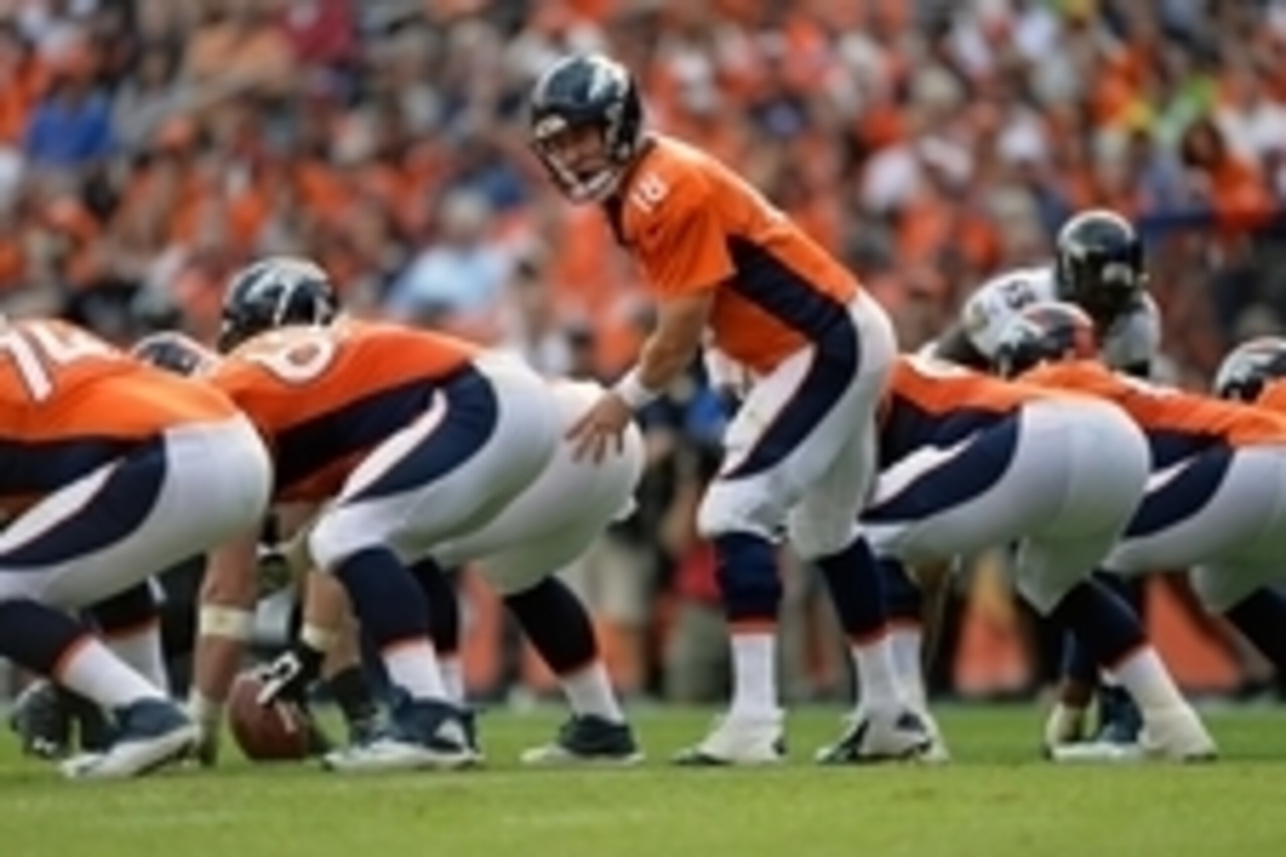 Sep 13, 2015; Denver, CO, USA; Denver Broncos quarterback Peyton Manning (18) calls out behind center Matt Paradis (61) and guard Evan Mathis (69) and offensive tackle Ty Sambrailo (74) in the third quarter against the Baltimore Ravens at Sports Authority