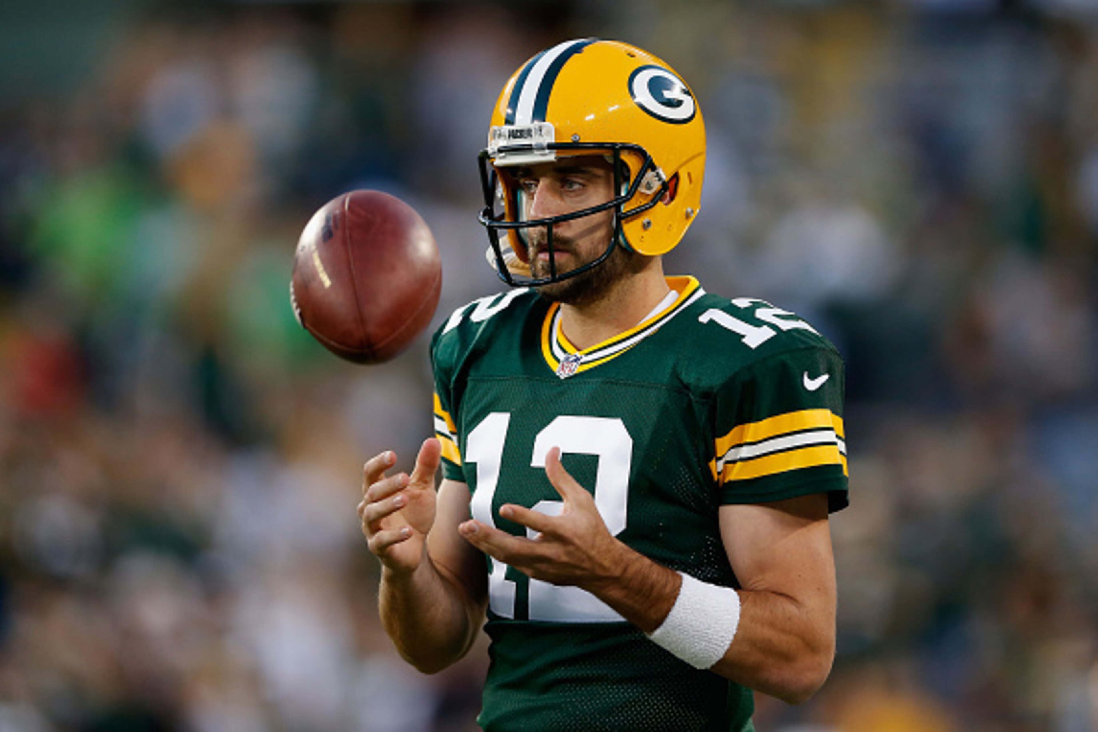GREEN BAY, WI - SEPTEMBER 20:  Quarterback Aaron Rodgers #12 of the Green Bay Packers warms up before the NFL game against the Seattle Seahawks at Lambeau Field on September 20, 2015 in Green Bay, Wisconsin.  The Packers defeated the Seahawks 27-17.  (Pho