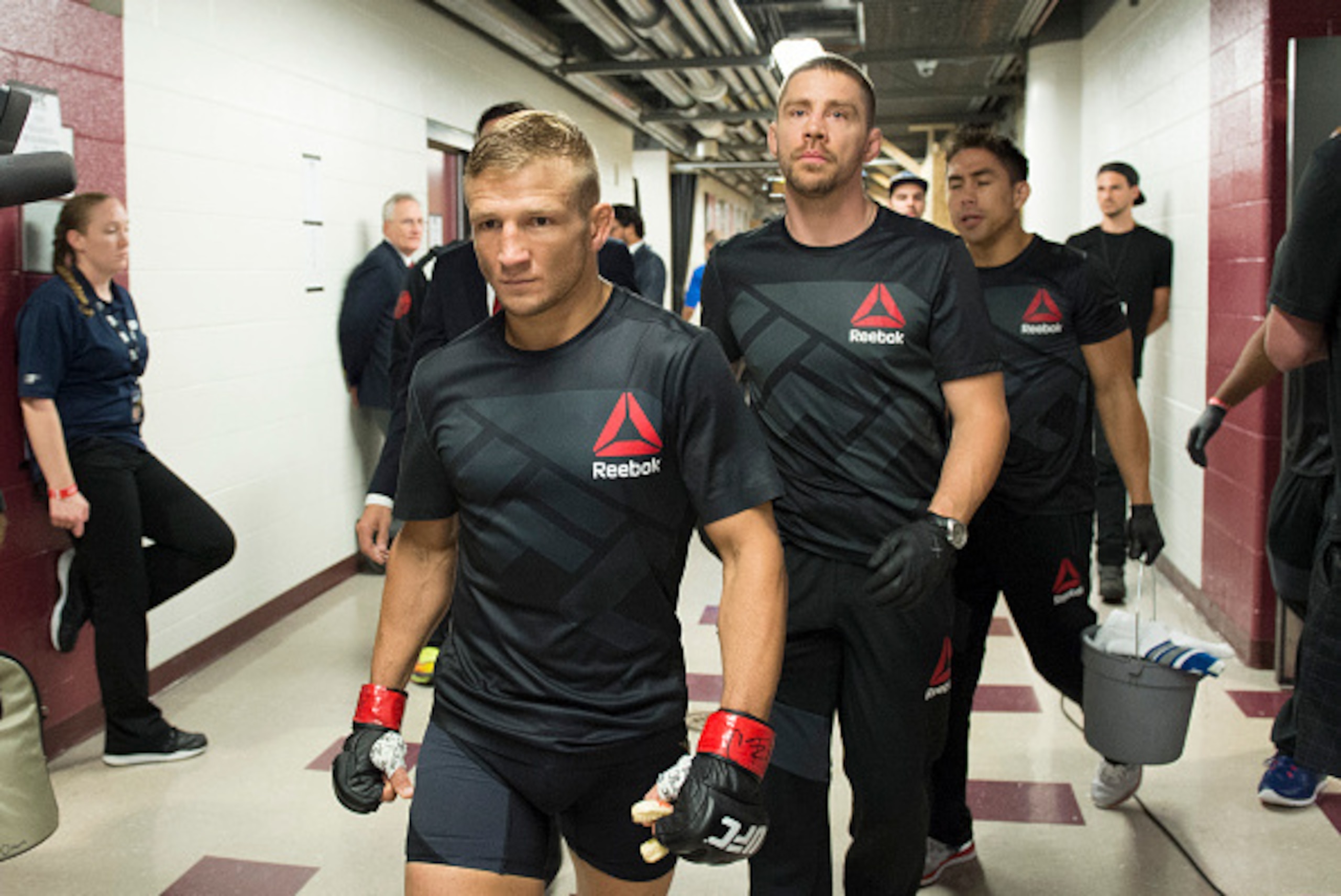 CHICAGO, IL - JULY 25:  UFC bantamweight champion TJ Dillashaw warms up backstage with coach Duane Ludwig (R) before facing Renan Barao of Brazil in their UFC bantamweight championship bout during the UFC event at the United Center on July 25, 2015 in Chi