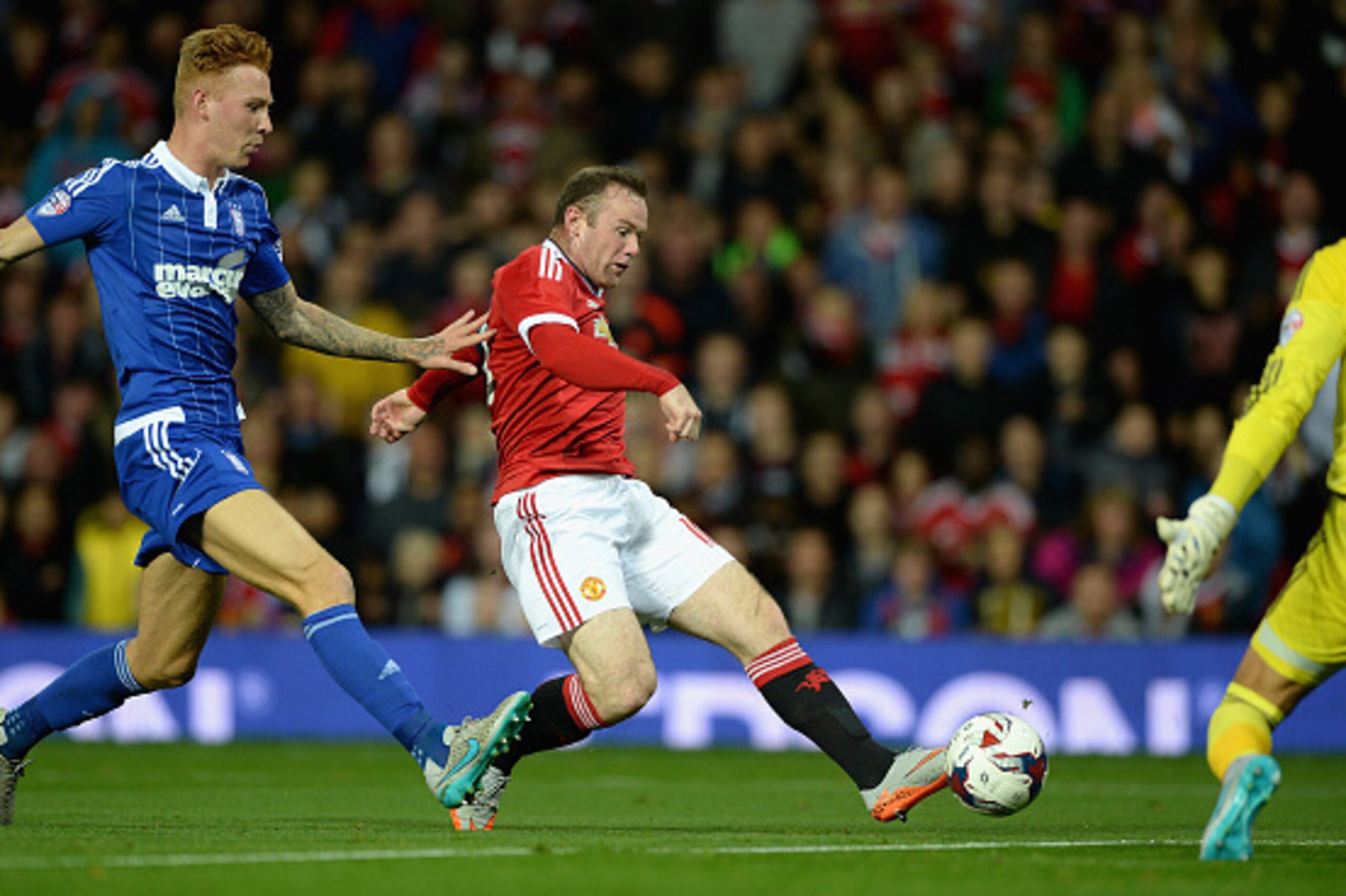 MANCHESTER, ENGLAND - SEPTEMBER 23:  Wayne Rooney of Manchester United scores the opening goal past Josh Yorwerth of Ipswich Town during the Capital One Cup Third Round match between Manchester United and Ipswich Town at Old Trafford on September 23, 2015