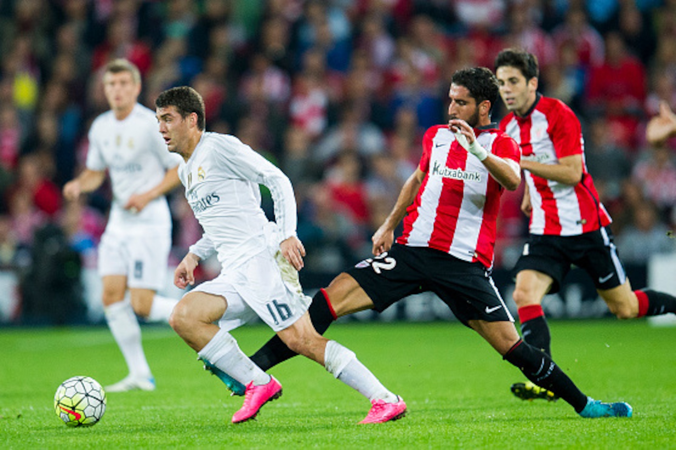 BILBAO, SPAIN - SEPTEMBER 23: Mateo Kovacic of Real Madrid CF duels for the ball with Raul Garcia of Athletic Club Bilbao during the La Liga match between Athletic Club Bilbao and Real Madrid CF at San Mames Stadium on September 23, 2015 in Bilbao, Spain.