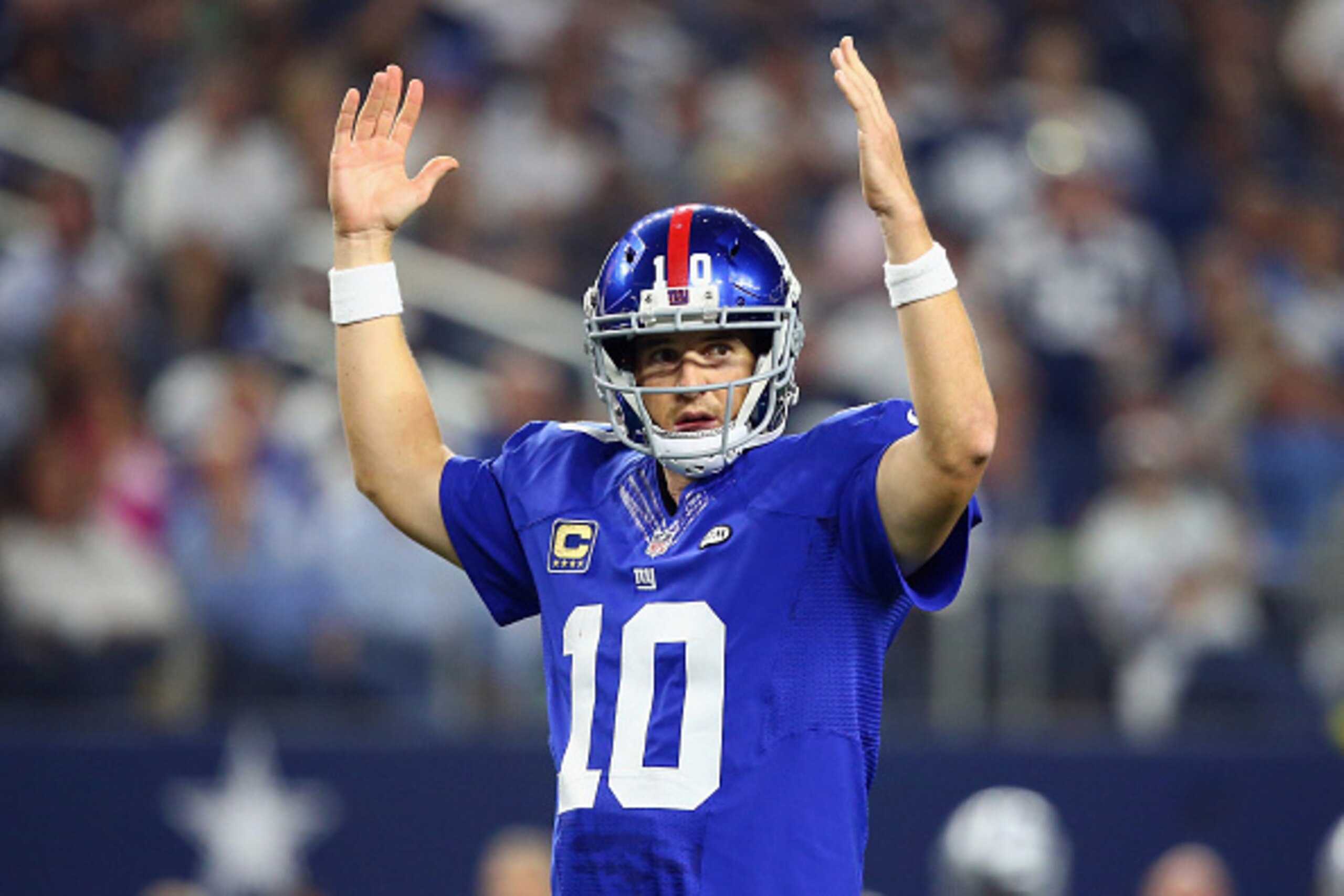 ARLINGTON, TX - SEPTEMBER 13:   Eli Manning #10 of the New York Giants celebrates the touchdown by  Rashad Jennings #23 in the fourth quarter against the Dallas Cowboys at AT&T Stadium on September 13, 2015 in Arlington, Texas.  (Photo by Ronald Martinez/