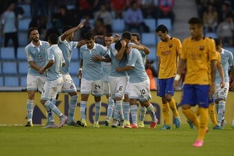 Celta Vigo's forward Nolito (C) celebrates with teammates after scoring a goal during the Spanish league football match Celta Vigo vs FC Barcelona at the Balaidos stadium in Vigo on September 23, 2015.  AFP PHOTO / MIGUEL RIOPA        (Photo credit should