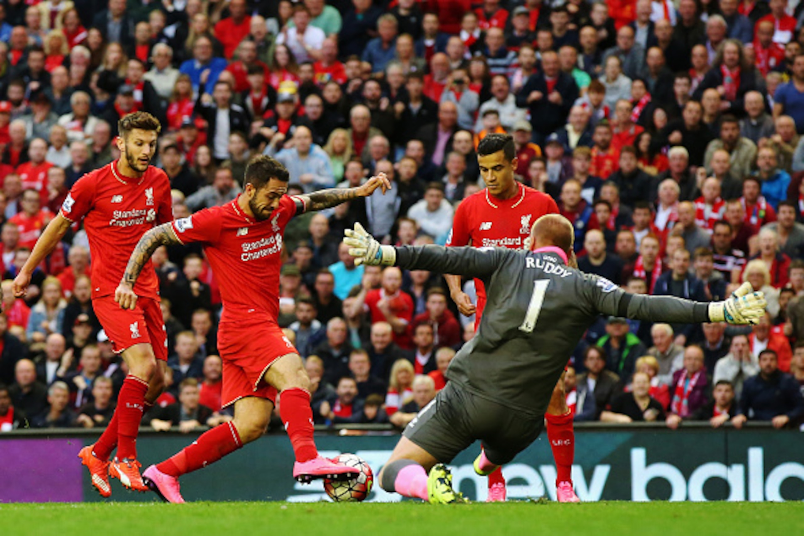 LIVERPOOL, ENGLAND - SEPTEMBER 20:  Goalkeeper John Ruddy of Norwich City (1) faces Adam Lallana (L), Danny Ings (2L) and Philippe Coutinho of Liverpool (2R) during the Barclays Premier League match between Liverpool and Norwich City at Anfield on Septemb