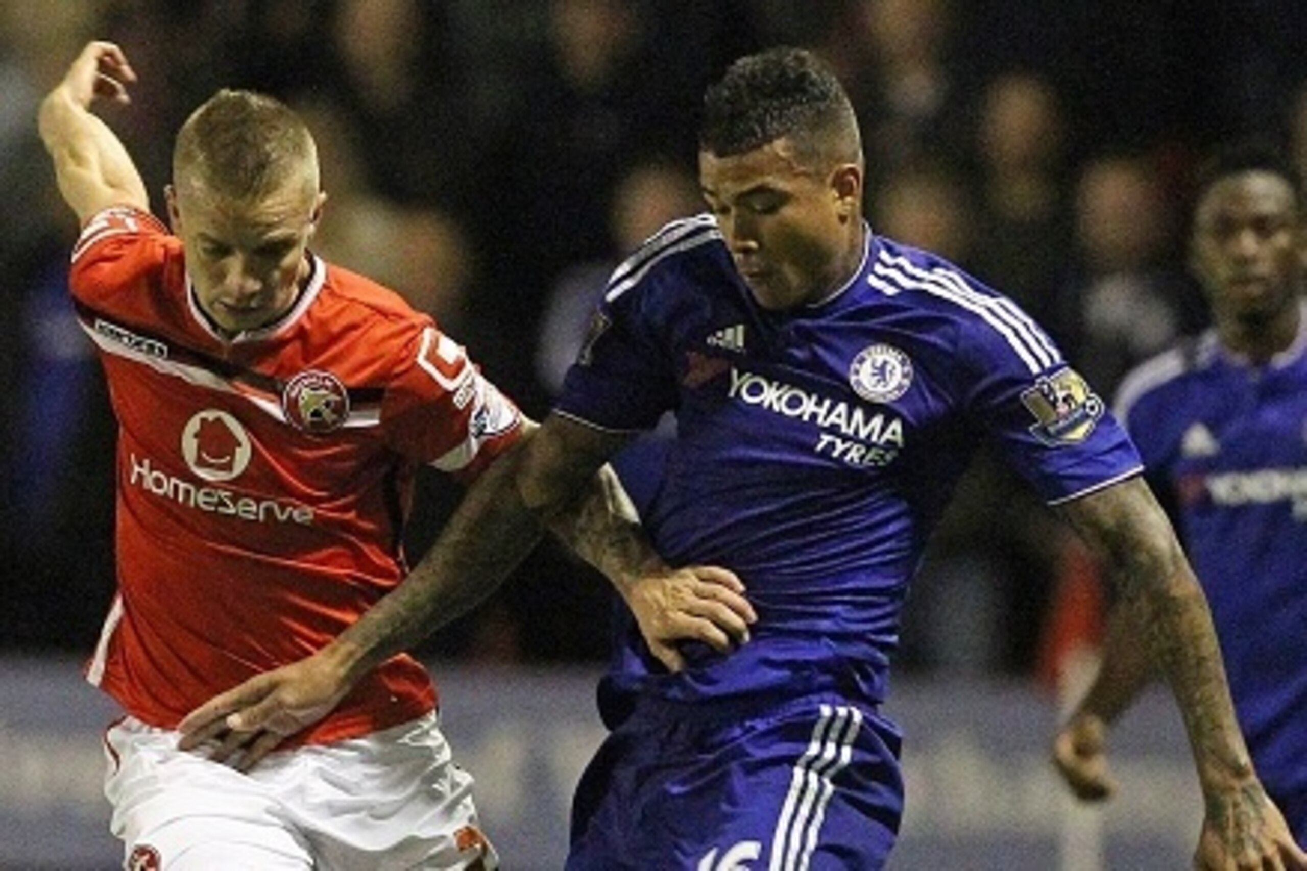 Walsall's Cypriot defender Jason Demetriou (L) vies with Chelsea's Brazilian striker Kenedy during the English League Cup third round football match between Walsall and Chelsea at The Banks's Stadium in Walsall, central England on September 23, 2015. AFP 