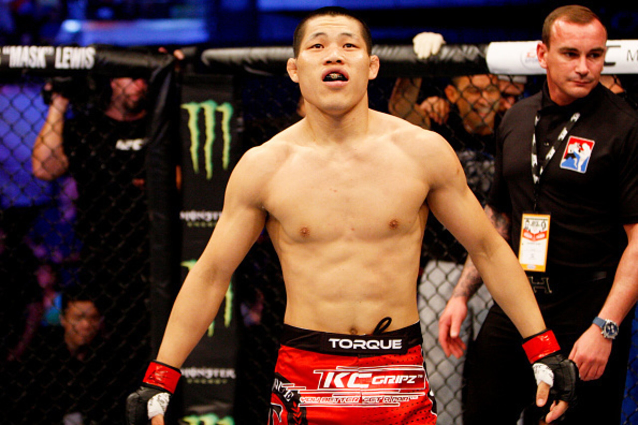 MANILA, PHILIPPINES - MAY 16: Li Jingling of China reacts  after defeating Dhiego Lima of Brazil in their welterweight fight during the UFC Fight Night event at the Mall of Asia Arena on May 16, 2015 in Manila, Philippines. (Photo by Mitch Viquez/Zuffa LL