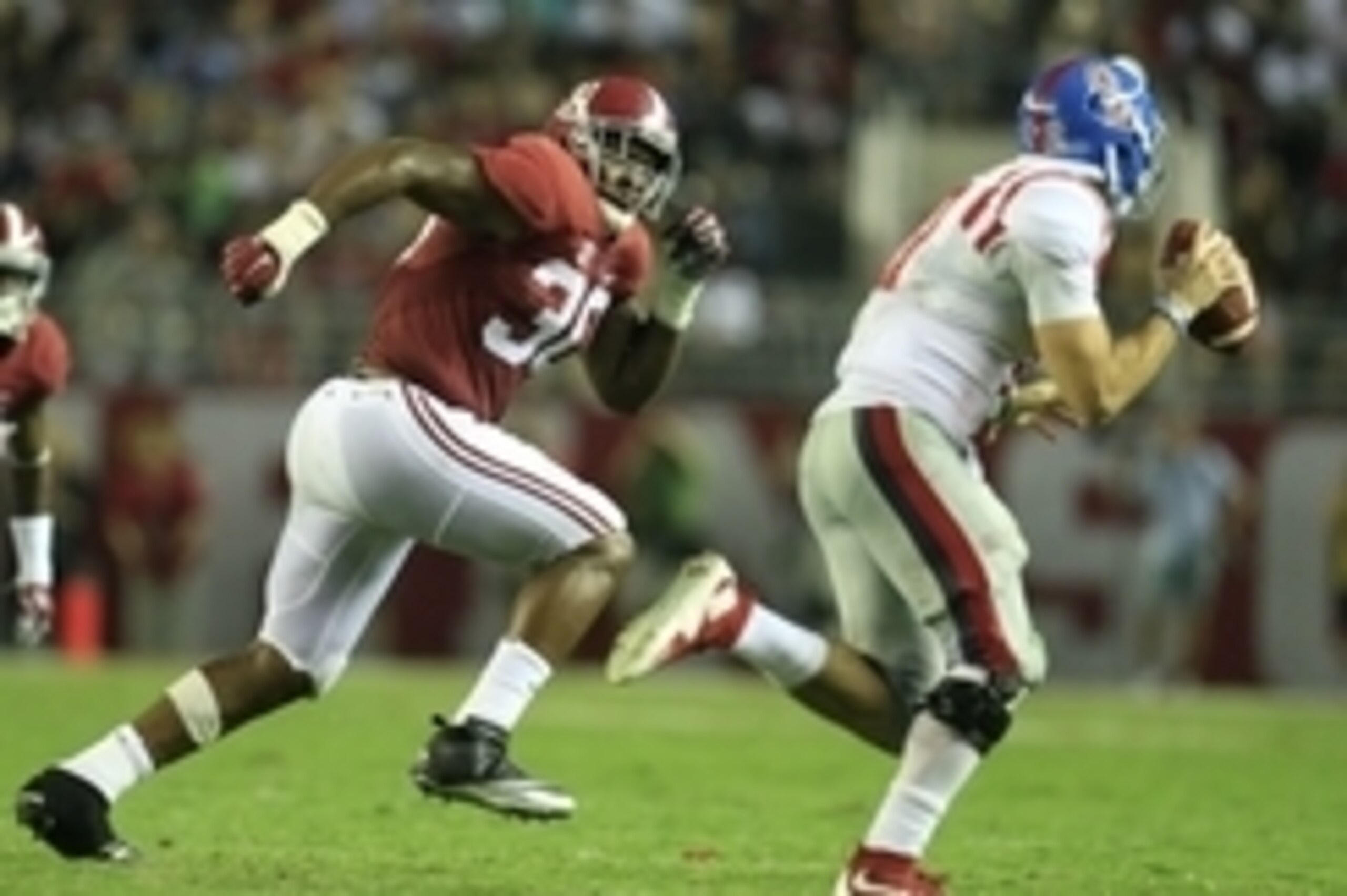 Sep 19, 2015; Tuscaloosa, AL, USA; Alabama Crimson Tide linebacker Denzel Devall (30) chases down Mississippi Rebels quarterback Chad Kelly (10) at Bryant-Denny Stadium. The Rebels defeated the Tide 43-37. Mandatory Credit: Marvin Gentry-USA TODAY Sports