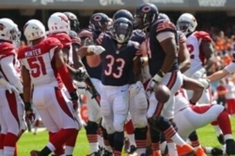 Sep 20, 2015; Chicago, IL, USA; Chicago Bears running back Jeremy Langford (33) celebrates scoring a touchdown during the first half against the Arizona Cardinals at Soldier Field. Mandatory Credit: Dennis Wierzbicki-USA TODAY Sports