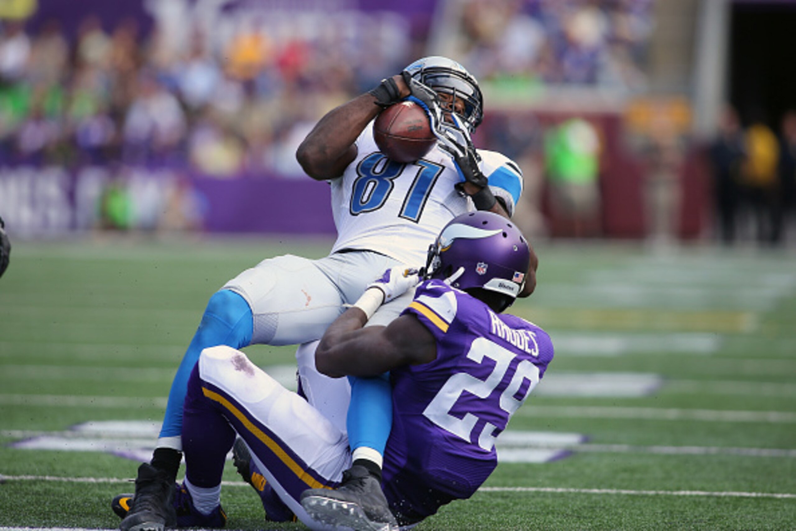 MINNEAPOLIS, MN - SEPTEMBER 20: Calvin Johnson #81 of the Detroit Lions gets tackled by Xavier Rhodes #29 of the Minnesota Vikings in the third quarter at TCF Bank Stadium on September 20, 2015 in Minneapolis, Minnesota. (Photo by Adam Bettcher/Getty Imag