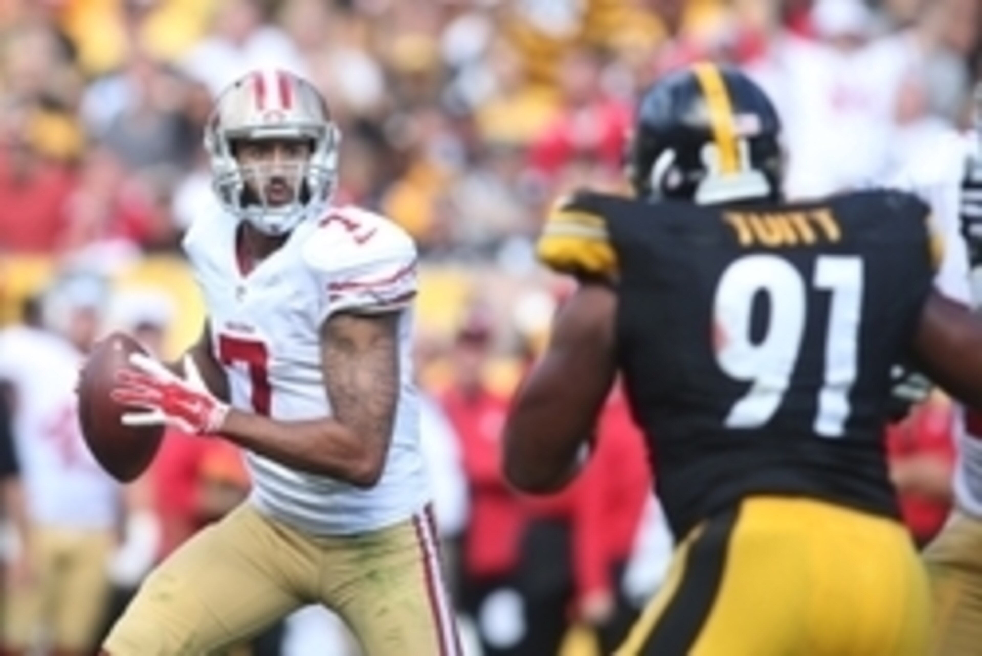 Sep 20, 2015; Pittsburgh, PA, USA; San Francisco 49ers quarterback Colin Kaepernick (7) prepares to throw the ball as Pittsburgh Steelers defensive end Stephon Tuitt (91) defends during the fourth quarter at Heinz Field. The Steelers won 43-18. Mandatory 