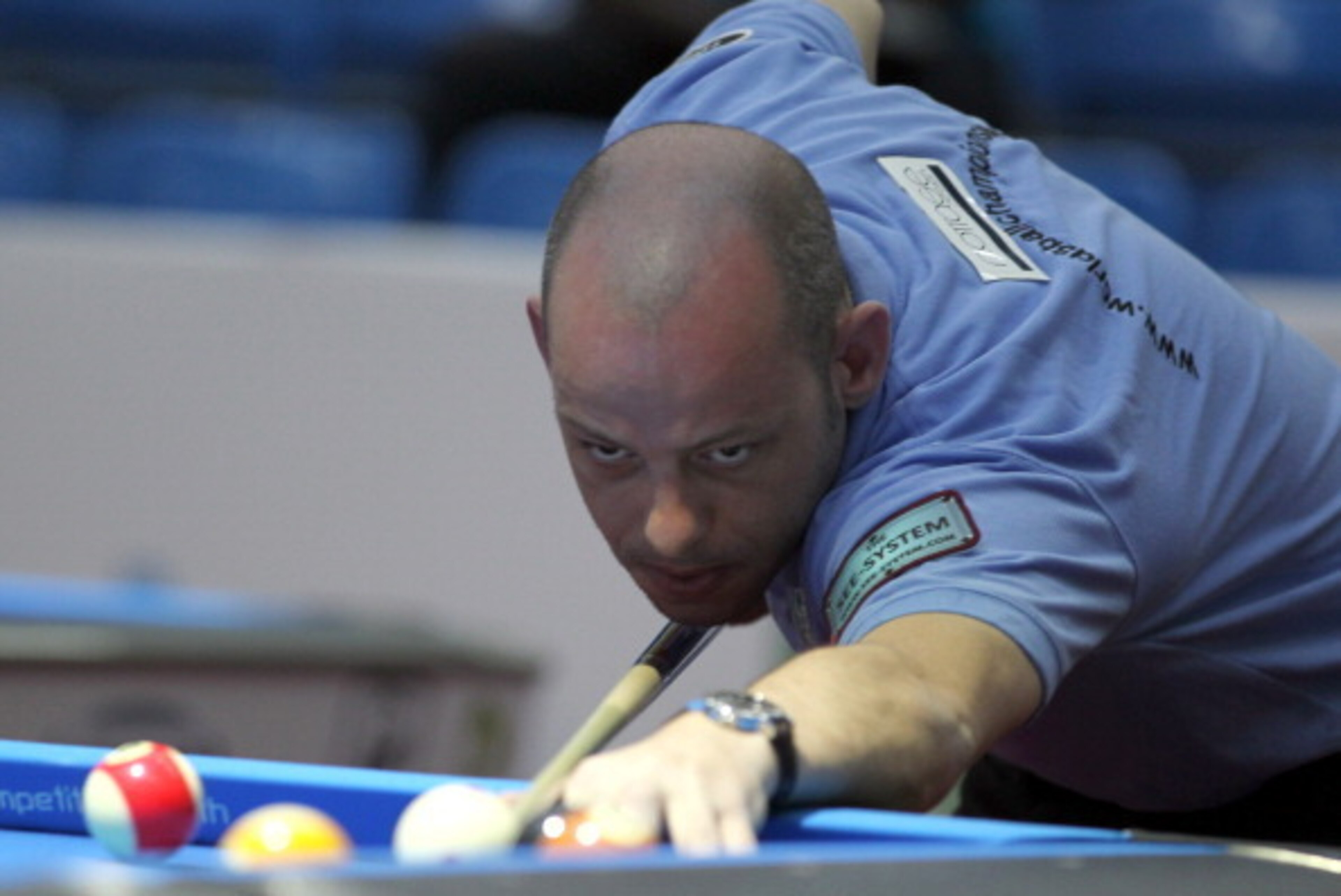 Darren Appleton of Britain eyes the ball during his game against Vilmos Foldes of Hungary in a qualifying round of the World 8 Ball Pool Championship at Fujairah on February 13, 2012. AFP PHOTO/KARIM SAHIB (Photo credit should read -/AFP/Getty Images)
