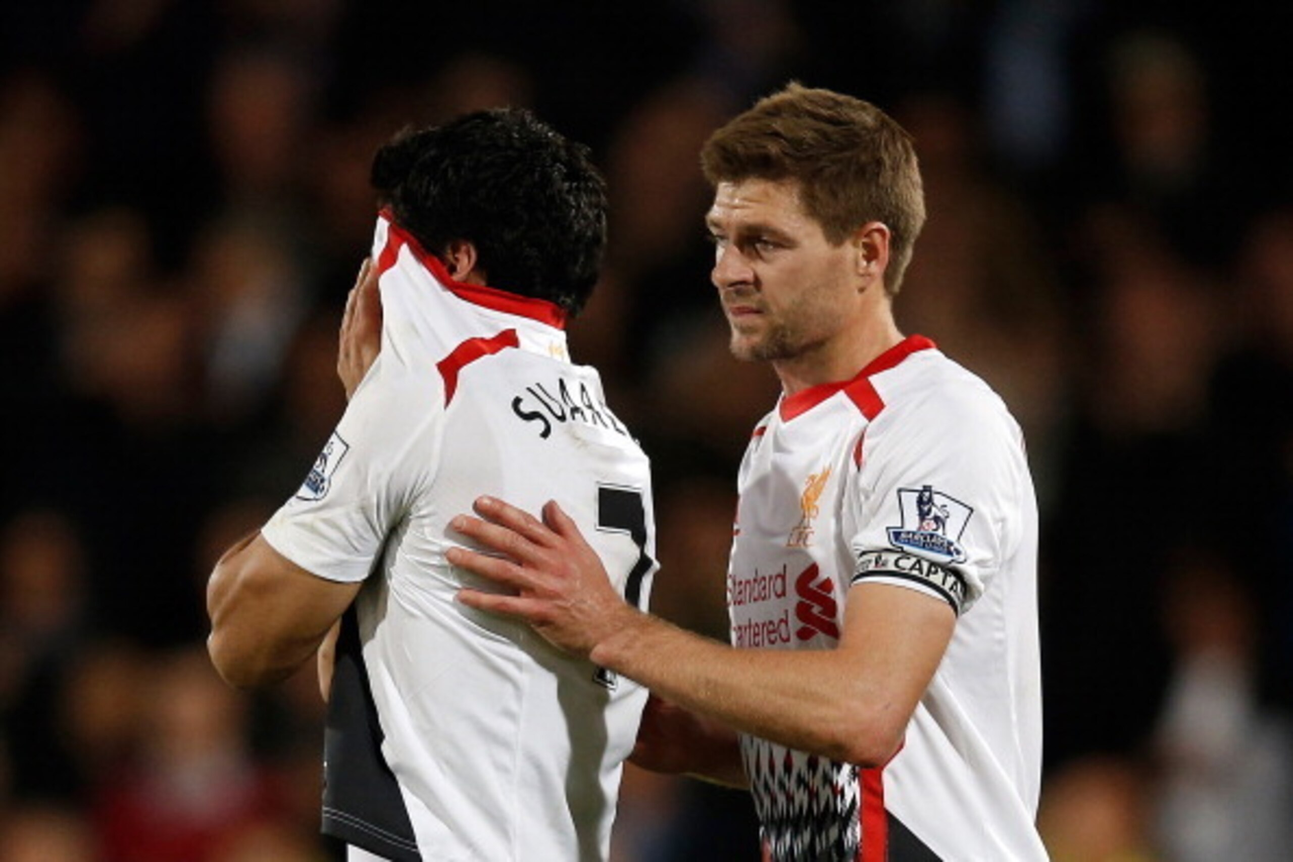 Liverpool's English midfielder Steven Gerrard (R) shepherds Liverpool's Uruguayan striker Luis Suarez (L) from the field as he reacts at the end of the English Premier League football match between Crystal Palace and Liverpool at Selhurst Park in south Lo Liverpool's English midfielder Steven Gerrard (R) shepherds Liverpool's Uruguayan striker Luis Suarez (L) from the field as he reacts at the end of the English Premier League football match between Crystal Palace and Liverpool at Selhurst Park in south Lo