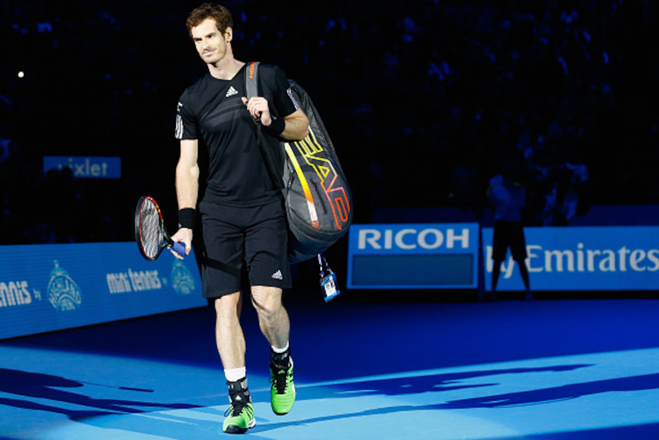 LONDON, ENGLAND - NOVEMBER 16: Andy Murray of Great Britain enters the court for the exhibition match against Novak Djokovic of Serbia on day eight of the Barclays ATP World Tour Finals at O2 Arena on November 16, 2014 in London, England. The Singles fina LONDON, ENGLAND - NOVEMBER 16: Andy Murray of Great Britain enters the court for the exhibition match against Novak Djokovic of Serbia on day eight of the Barclays ATP World Tour Finals at O2 Arena on November 16, 2014 in London, England. The Singles fina
