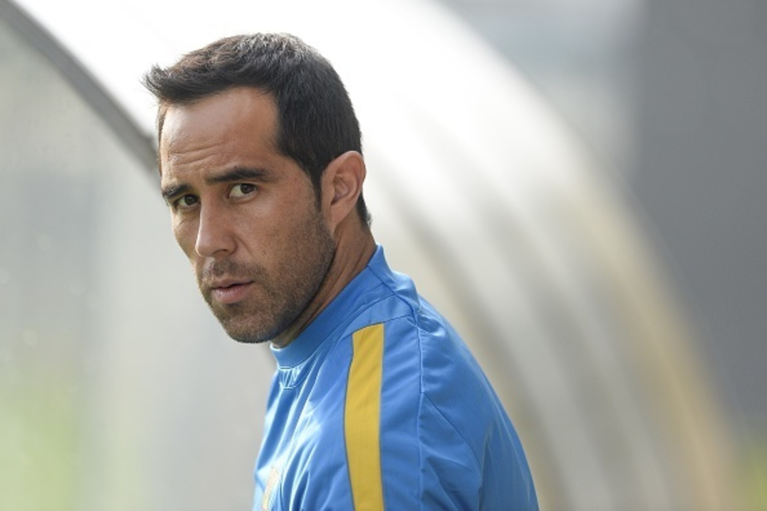 Barcelona's Chilean goalkeeper Claudio Bravo looks on during a training session at the Sports Center FC Barcelona Joan Gamper in Sant Joan Despi, near Barcelona on August 22, 2015 on the eve of the first Spanish League 'La Liga' football match against At Barcelona's Chilean goalkeeper Claudio Bravo looks on during a training session at the Sports Center FC Barcelona Joan Gamper in Sant Joan Despi, near Barcelona on August 22, 2015 on the eve of the first Spanish League 'La Liga' football match against At