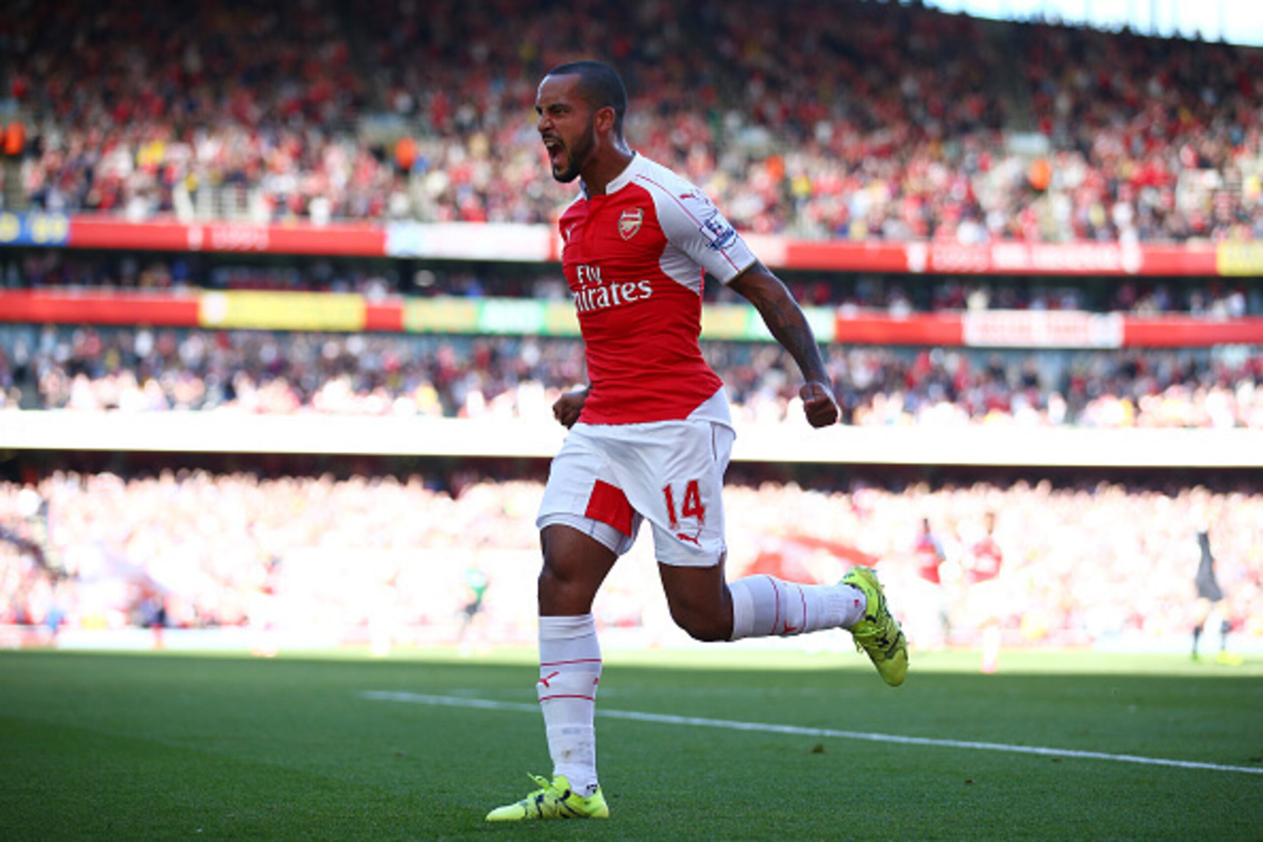 LONDON, ENGLAND - SEPTEMBER 12:  Theo Walcott of Arsenal celebrates scoring the opening goal during the Barclays Premier League match between Arsenal and Stoke City at the Emirates Stadium on September 12, 2015 in London, United Kingdom.  (Photo by Paul G