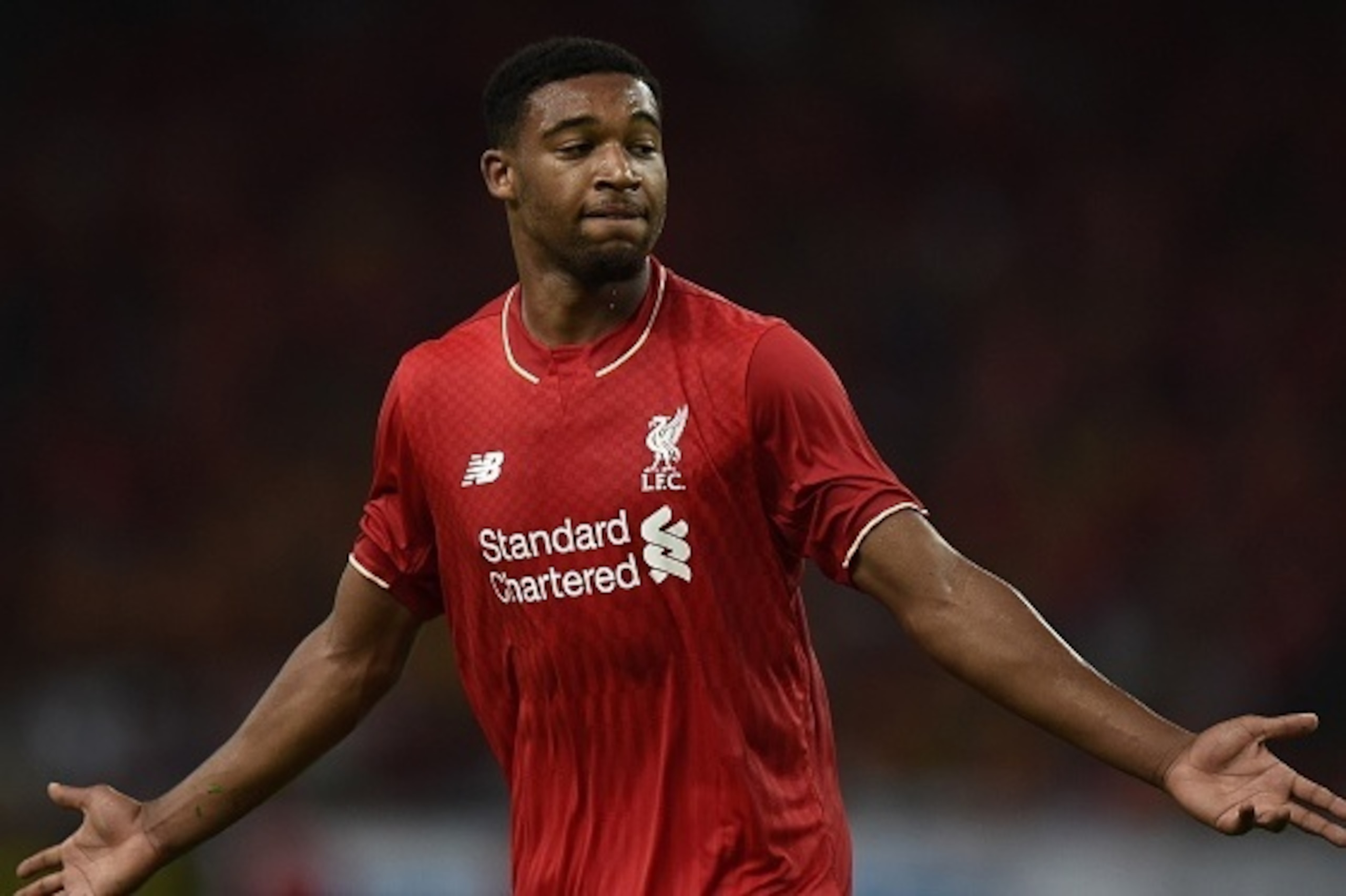 Liverpool's English midfielder Jordon Ibe celebrates after scoring a goal against Malaysia XI during their friendly football match at the Bukit Jalil Stadium in Kuala Lumpur on July 24, 2015. AFP PHOTO / MANAN VATSYAYANA        (Photo credit should read M
