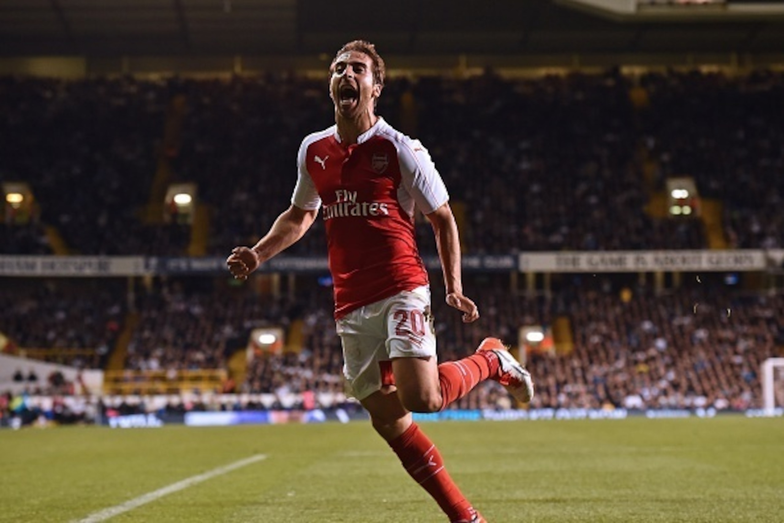 Arsenal's French midfielder Mathieu Flamini celebrates after scoring their seond goal during the English League Cup third round football match between Tottenham Hotspur and Arsenal at White Hart Lane in north London on September 23, 2015. AFP PHOTO / BEN 