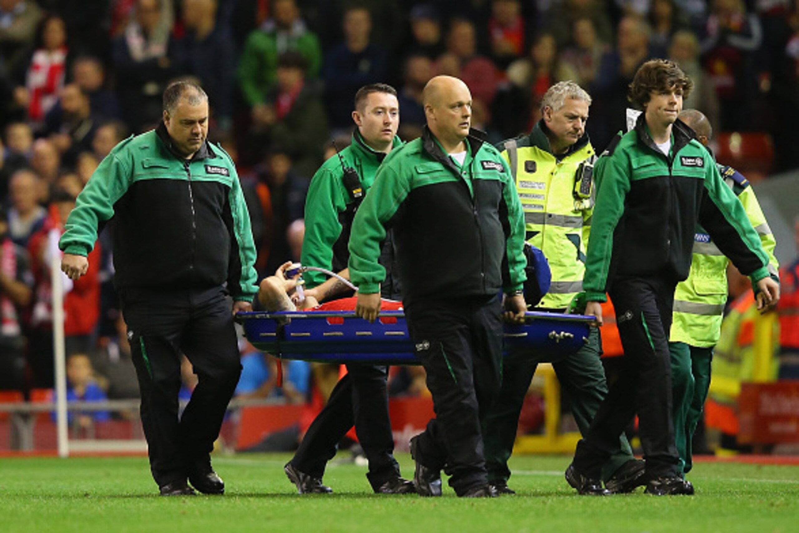 LIVERPOOL, ENGLAND - SEPTEMBER 23:  Dejan Lovren of Liverpool is stretchered from the pitch after suffering a injury during the Capital One Cup Third Round match between Liverpool and Carlisle United at Anfield on September 23, 2015 in Liverpool, England.