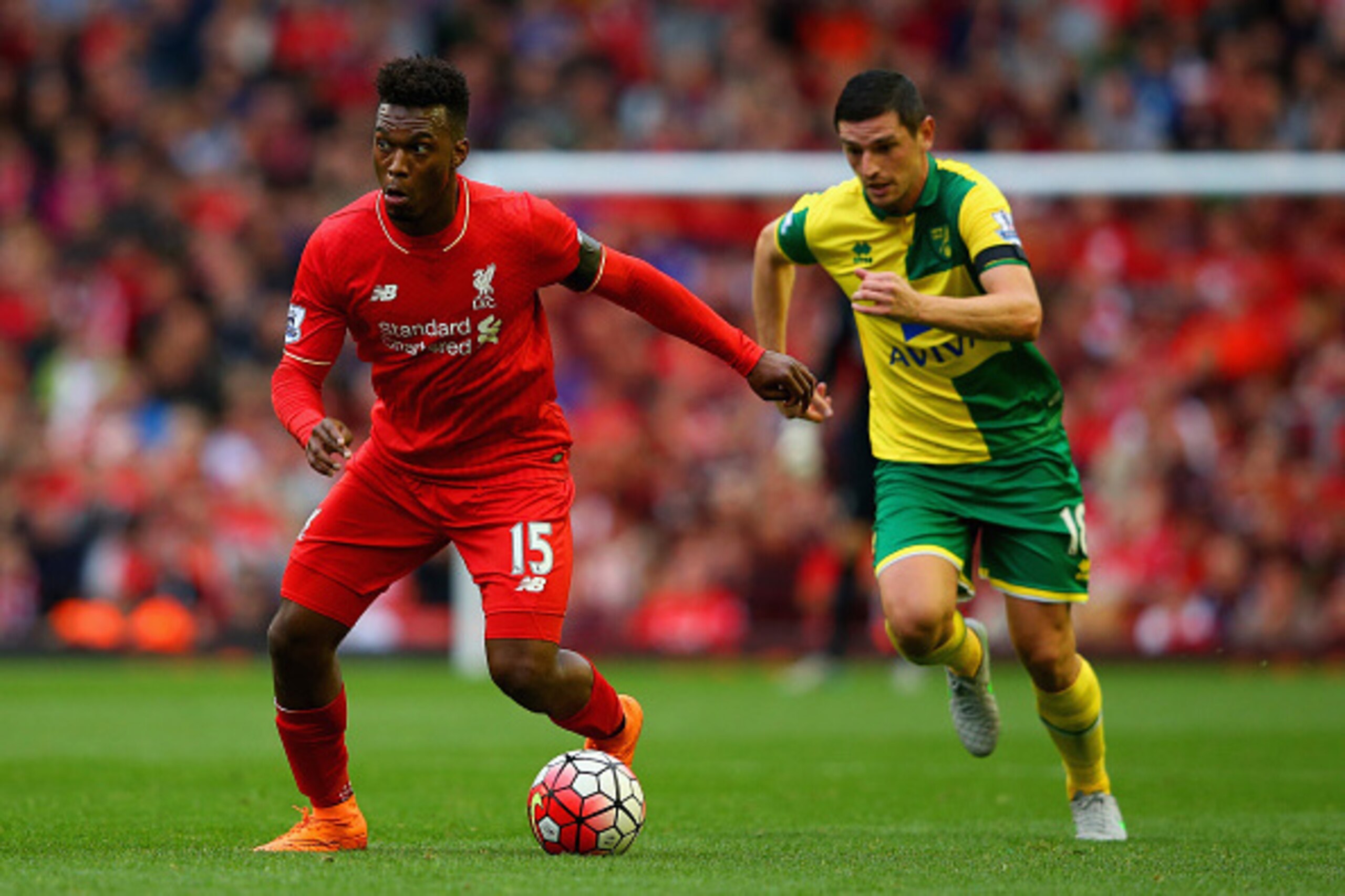 LIVERPOOL, ENGLAND - SEPTEMBER 20: Daniel Sturridge of Liverpool breaks away from Graham Dorrans of Norwich City  during the Barclays Premier League match between Liverpool and Norwich City at Anfield on September 20, 2015 in Liverpool, United Kingdom.  (