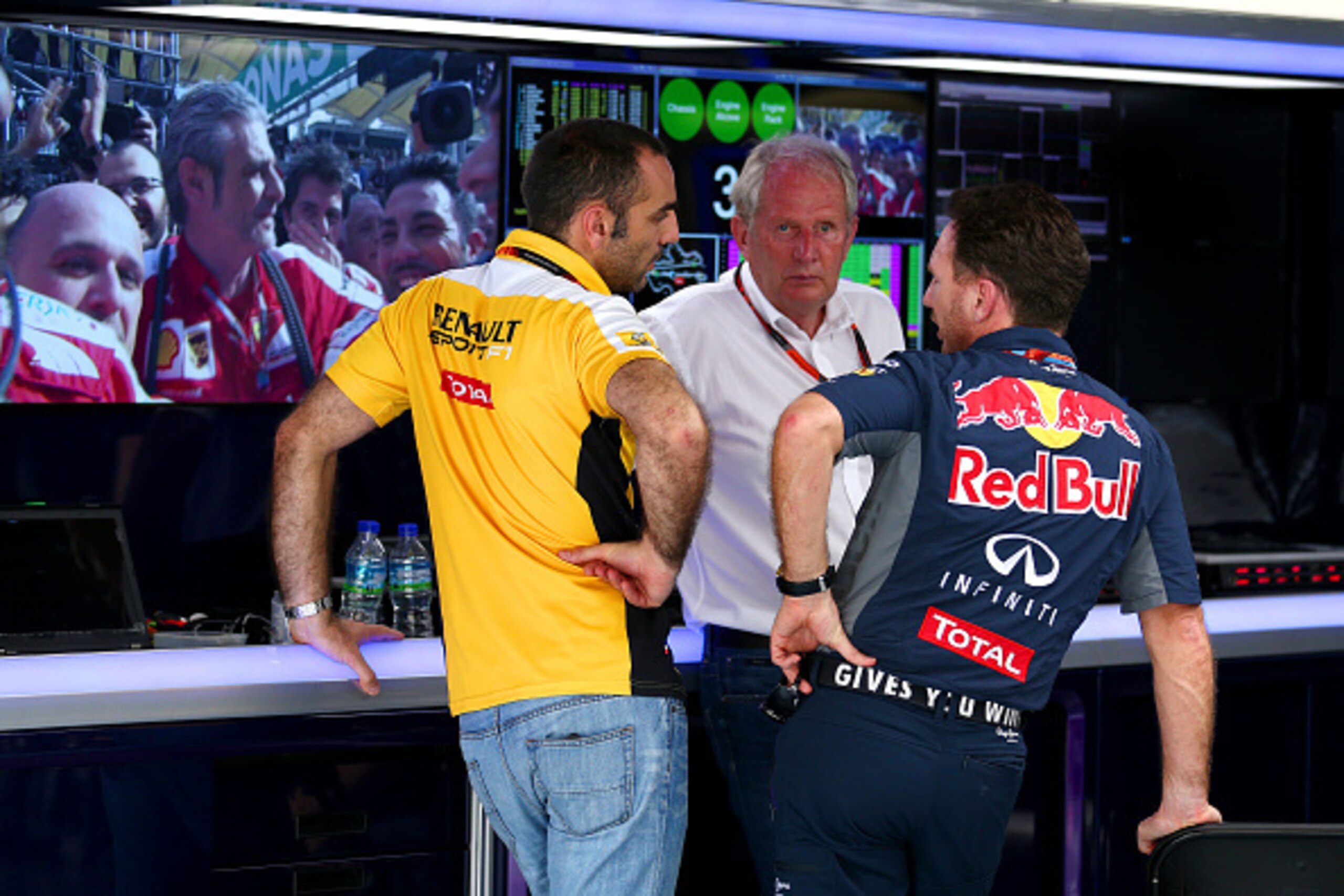 KUALA LUMPUR, MALAYSIA - MARCH 29:  Infiniti Red Bull Racing Team Principal Christian Horner and team consuwltant Dr Helmut Marko speak with Renault's Cyril Abiteboul in the team garage after the Malaysia Formula One Grand Prix at Sepang Circuit on March 