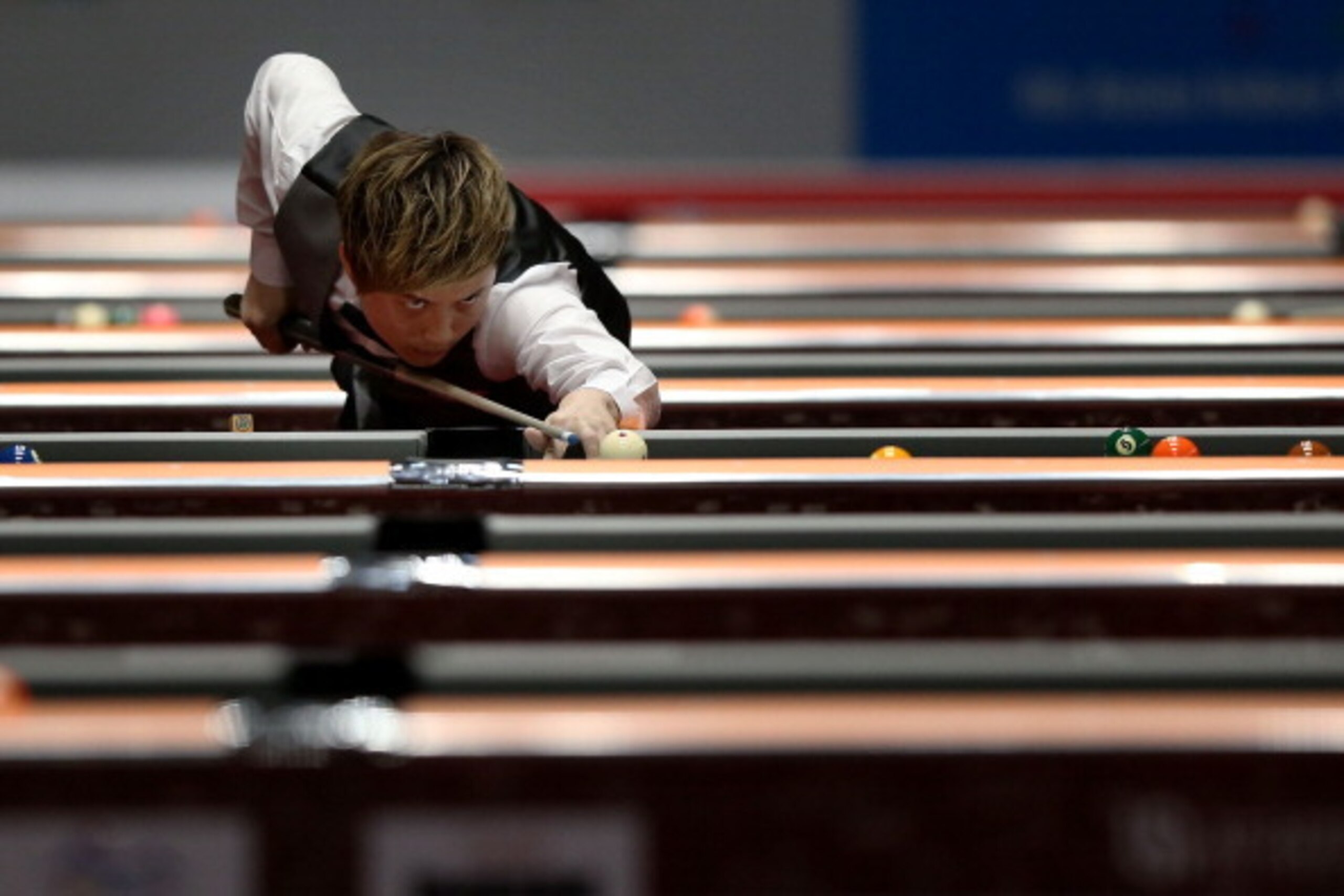 INCHEON, SOUTH KOREA - JULY 01:  Ko Pin Yi of Chinese Taipei plays a shot against Palajin Kobkit of Thailand during their Billiards, Men's 9 Ball Single Quarterfinals match at Songdo Convensia on day three of the 4th Asian Indoor & Martial Arts Games on J