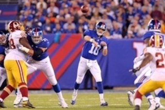 Sep 24, 2015; East Rutherford, NJ, USA; New York Giants quarterback Eli Manning (10) throws a pass against the Washington Redskins during the third quarter at MetLife Stadium. Mandatory Credit: Brad Penner-USA TODAY Sports